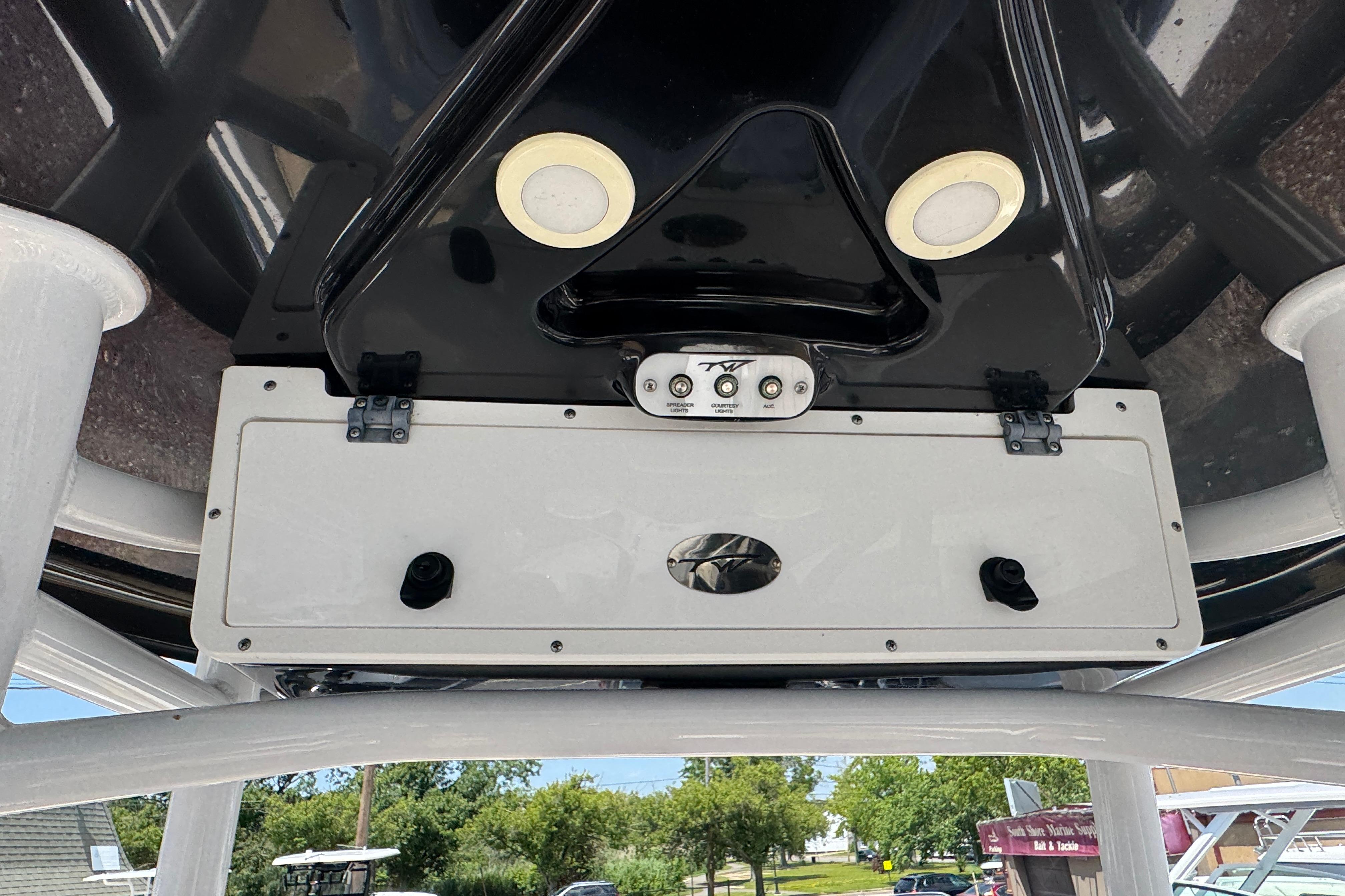 2016 Tidewater 230 LXF boat console with controls and speakers, viewed from below.