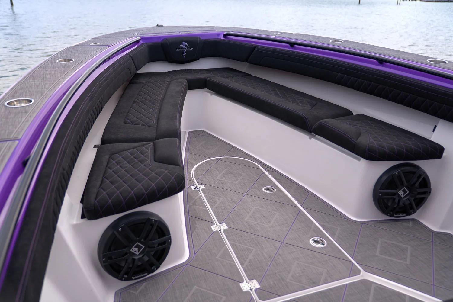 Manufacturer Provided Image: Luxurious interior of 2026 Statement 380 Open boat with black seating and purple accents.