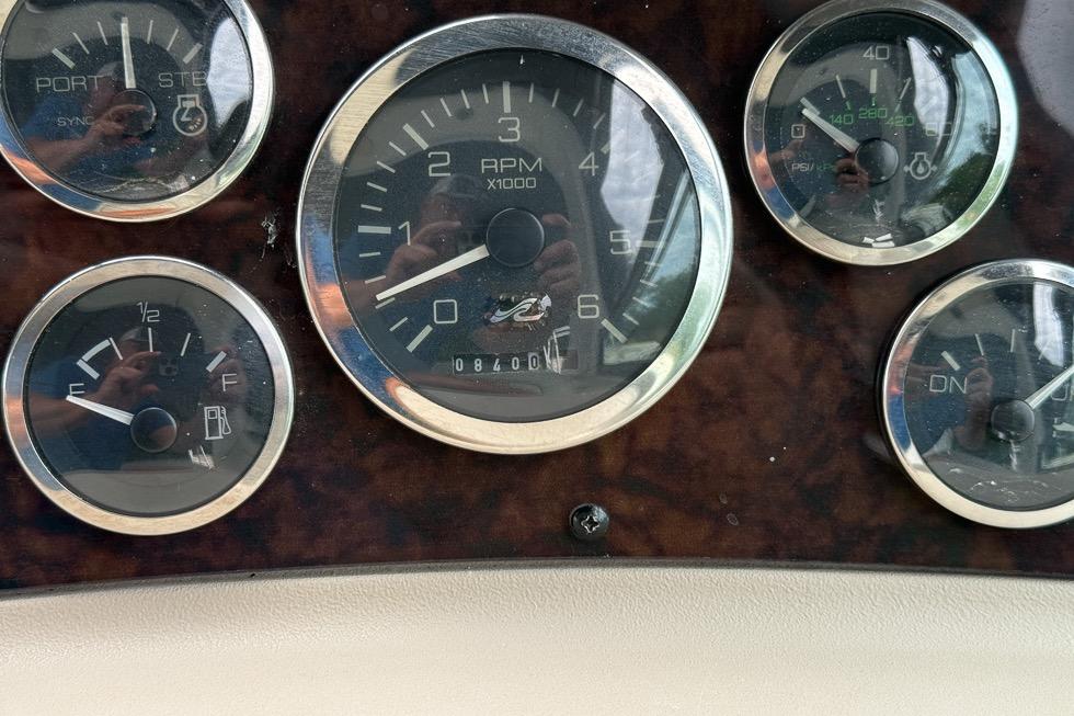 Dashboard gauges of a 1999 Sea Ray 290 Sundancer boat.