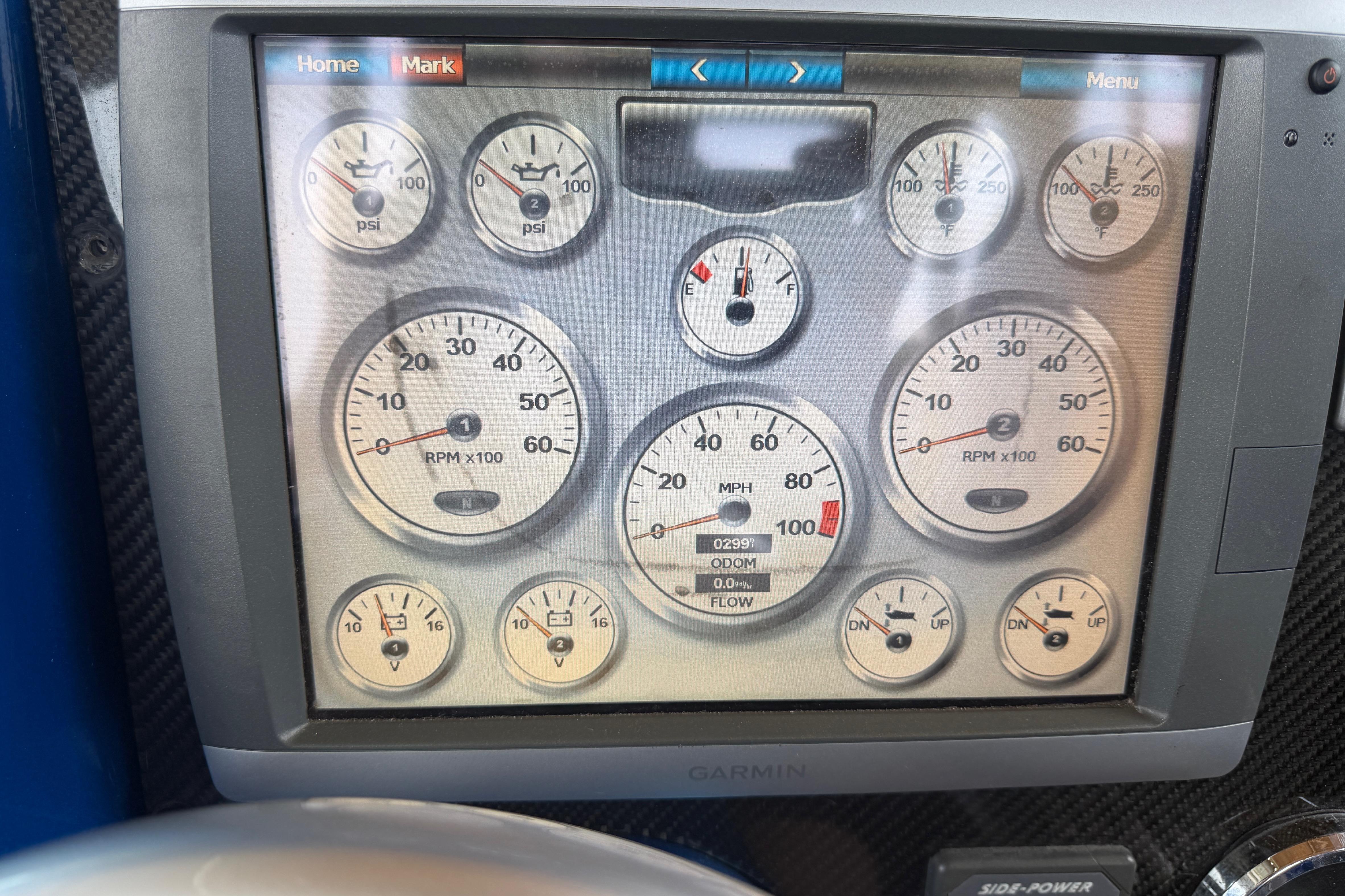 Dashboard of a 2013 Nor-Tech 477 SPX Vee Bottom with multiple gauges displayed.