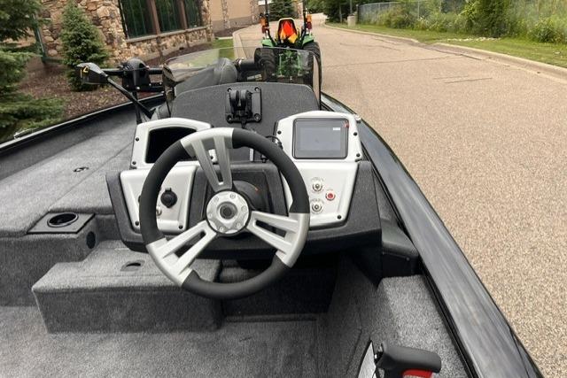 2026 Tracker Pro Team 175 boat interior with steering wheel and control panel.