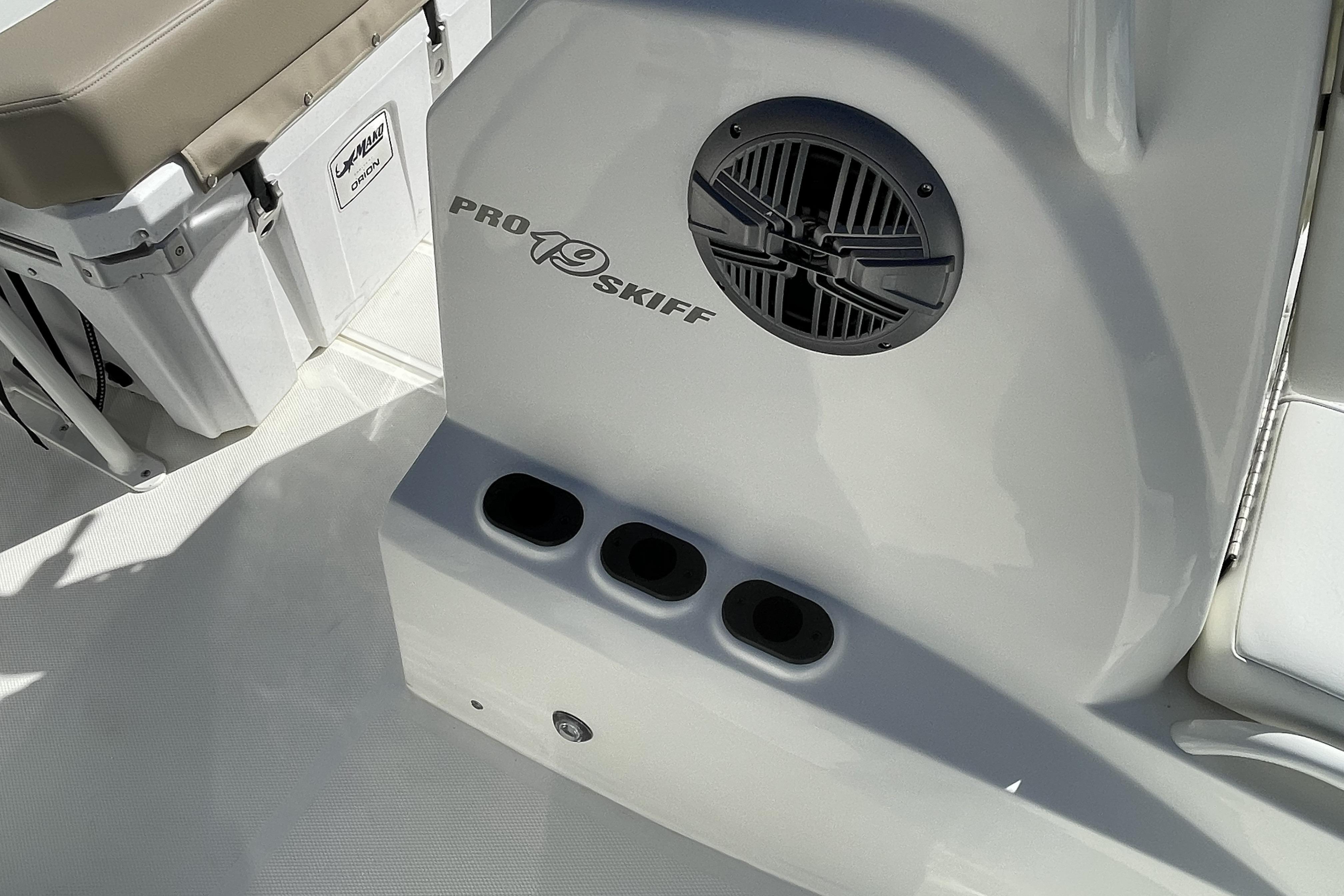 2026 Mako Pro Skiff 19 CC boat interior with speaker and storage compartments.