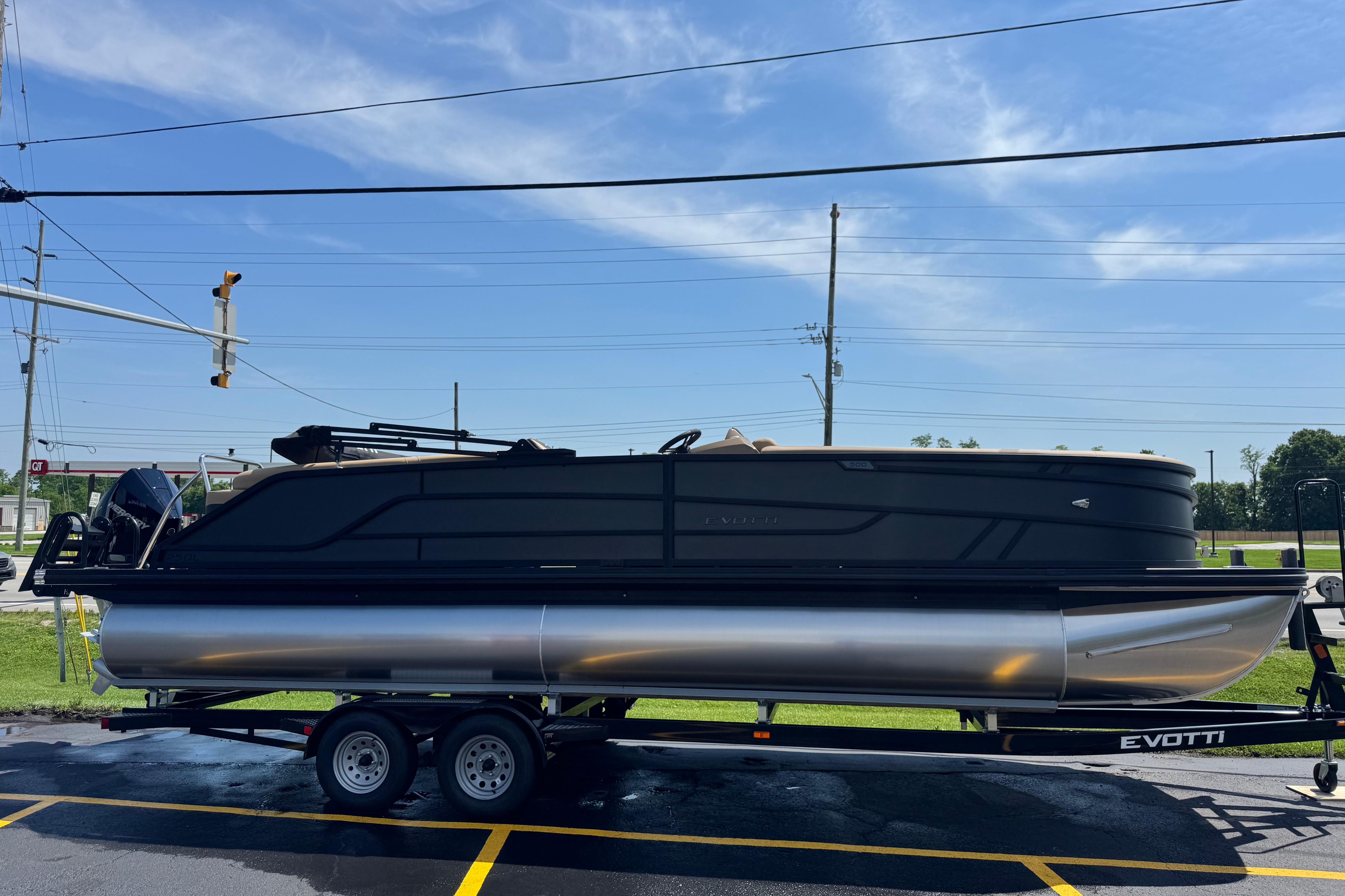 2026 Evotti 525QL pontoon boat on trailer under clear blue sky.