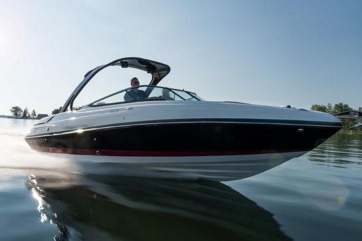 2017 Rinker QX29 BR boat on calm water.