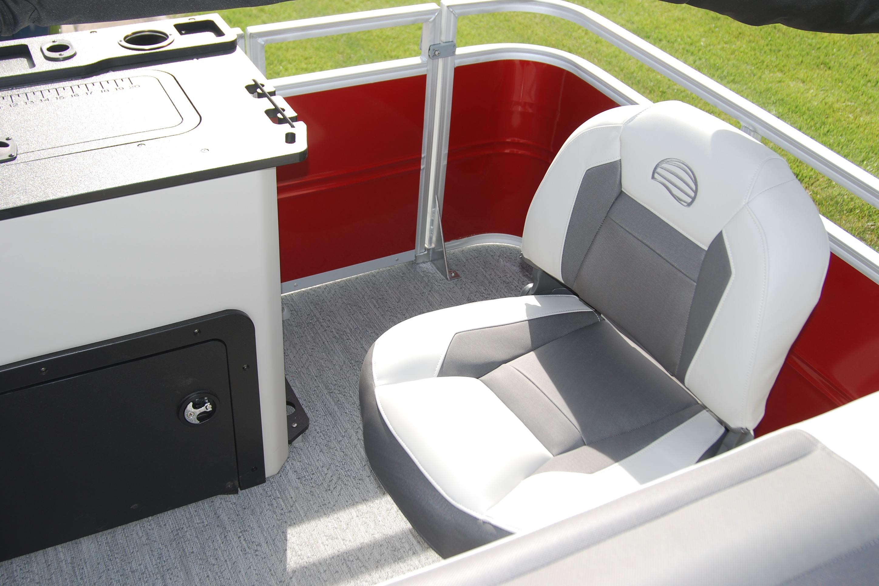 2026 Sun Tracker Fishin' Barge 22 XP3 interior with comfortable seating and fishing station.