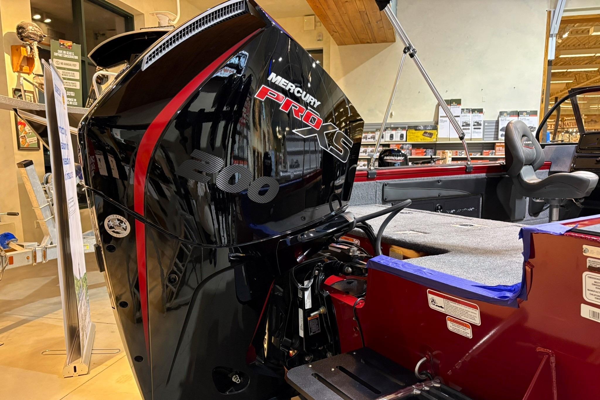 2025 Tracker Targa V-19 WT boat with Mercury Pro XS 200 engine in showroom.