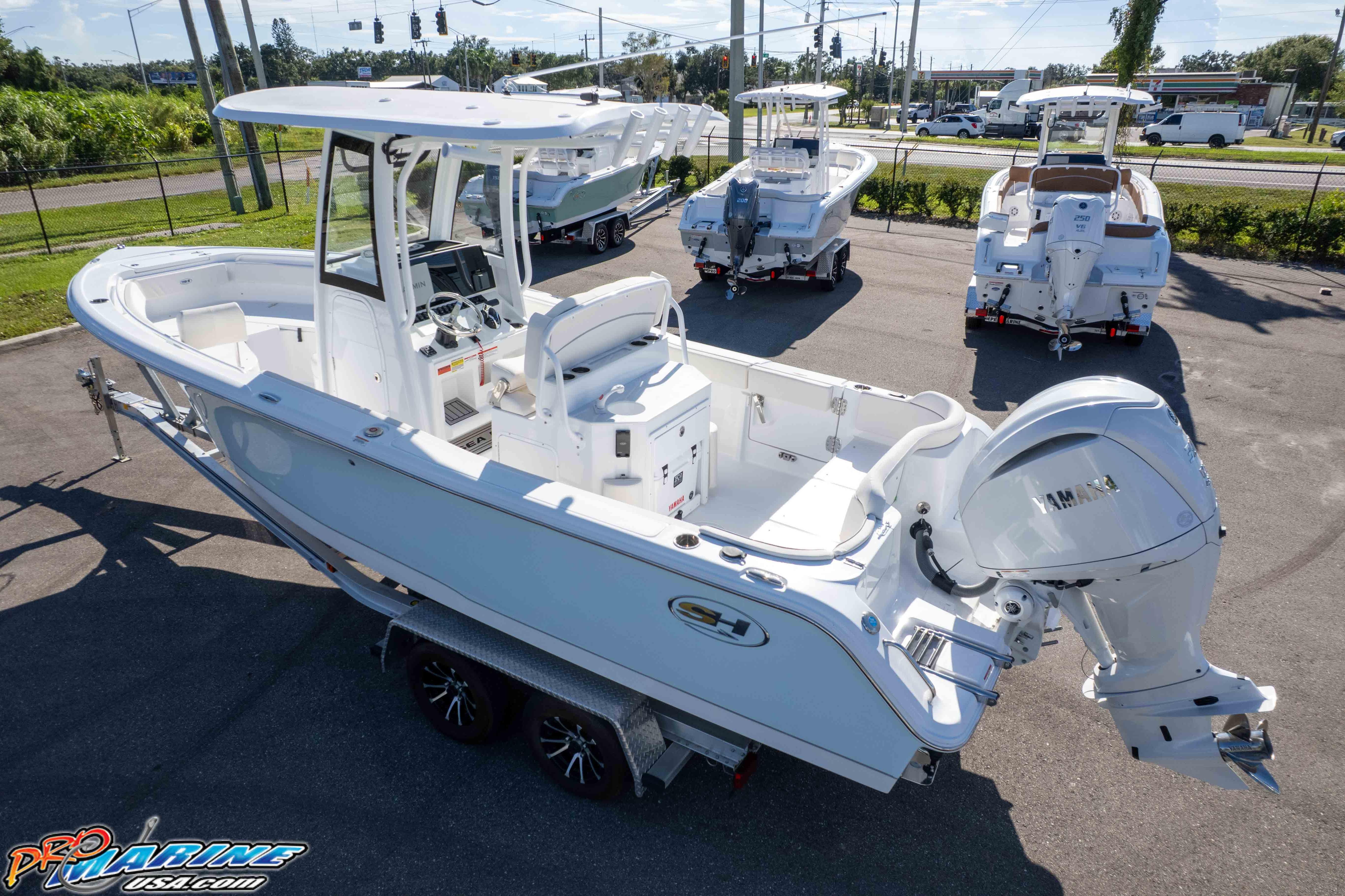 2025 Sea Hunt Ultra 245 SE boat with Yamaha engine, displayed outdoors on a trailer.