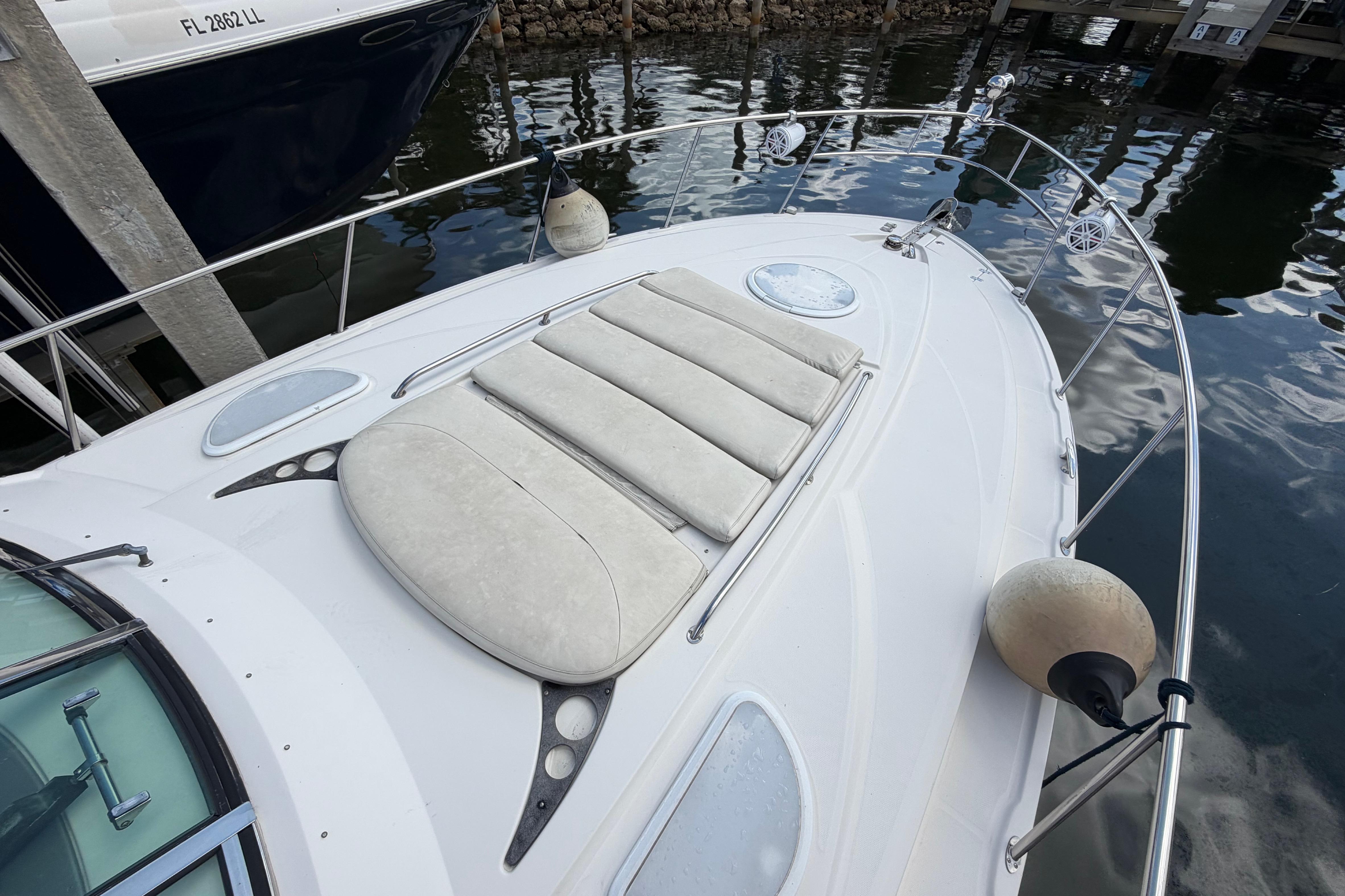 2007 Monterey 350 Sport Yacht docked, featuring spacious sunbathing area and sleek design.