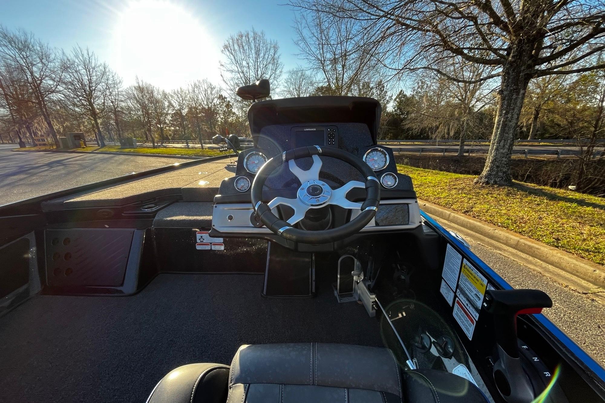 2024 Nitro Z19 boat cockpit with steering wheel and dashboard controls.