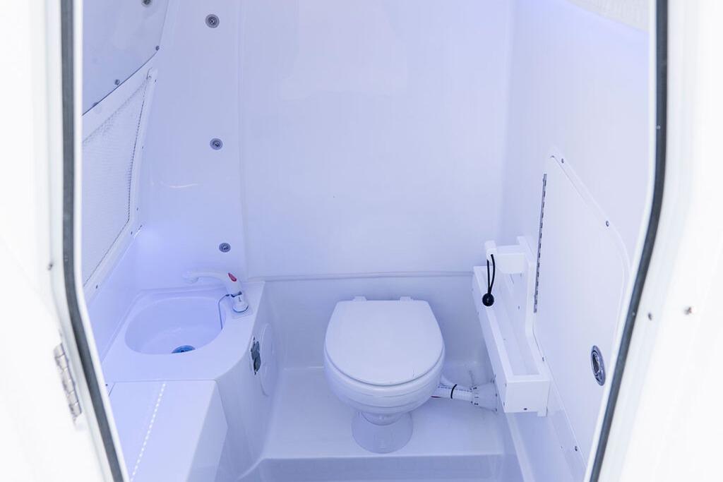 Interior of 2026 Sea Hunt Gamefish 28 Coffin Box boat bathroom.