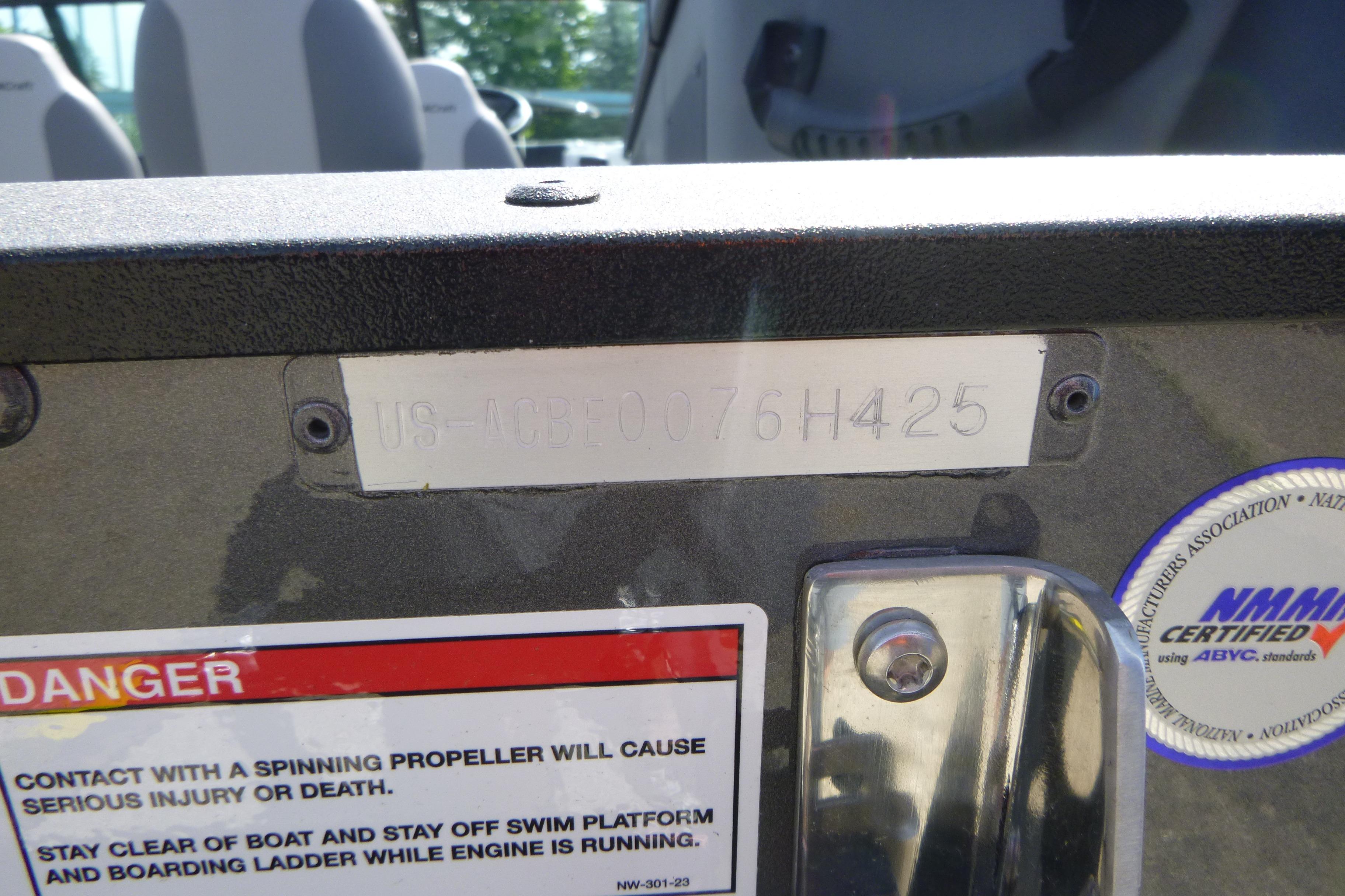 2025 Alumacraft Trophy 185X Sport boat identification plate with safety warning labels.
