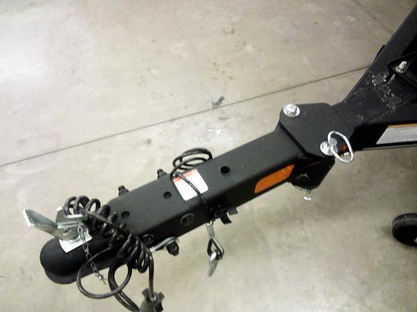Trailer hitch of a 2025 Ranger VS1665 SC on a concrete floor.