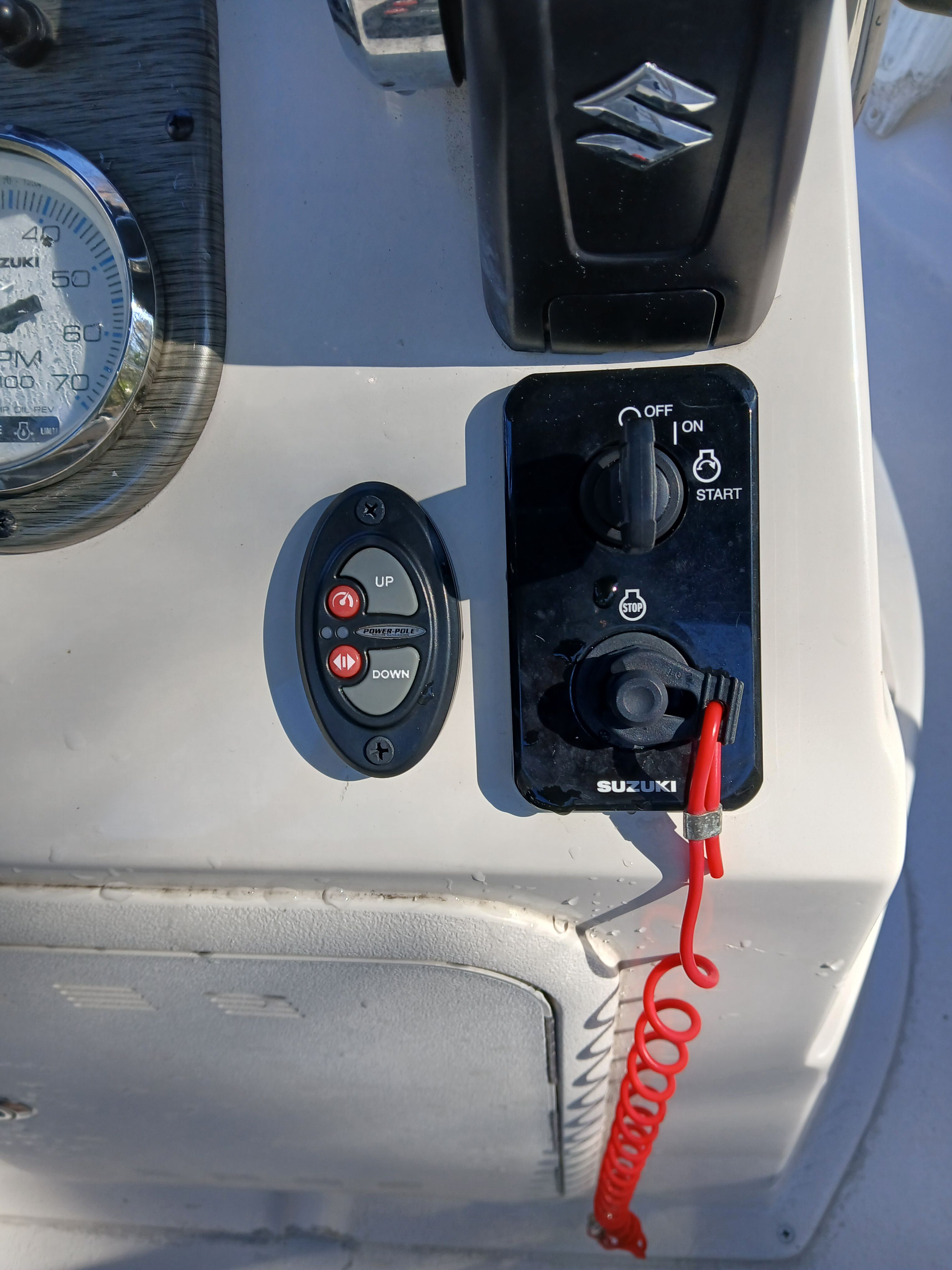 Control panel of a 2023 Carolina Skiff 192 JLS with Suzuki throttle.