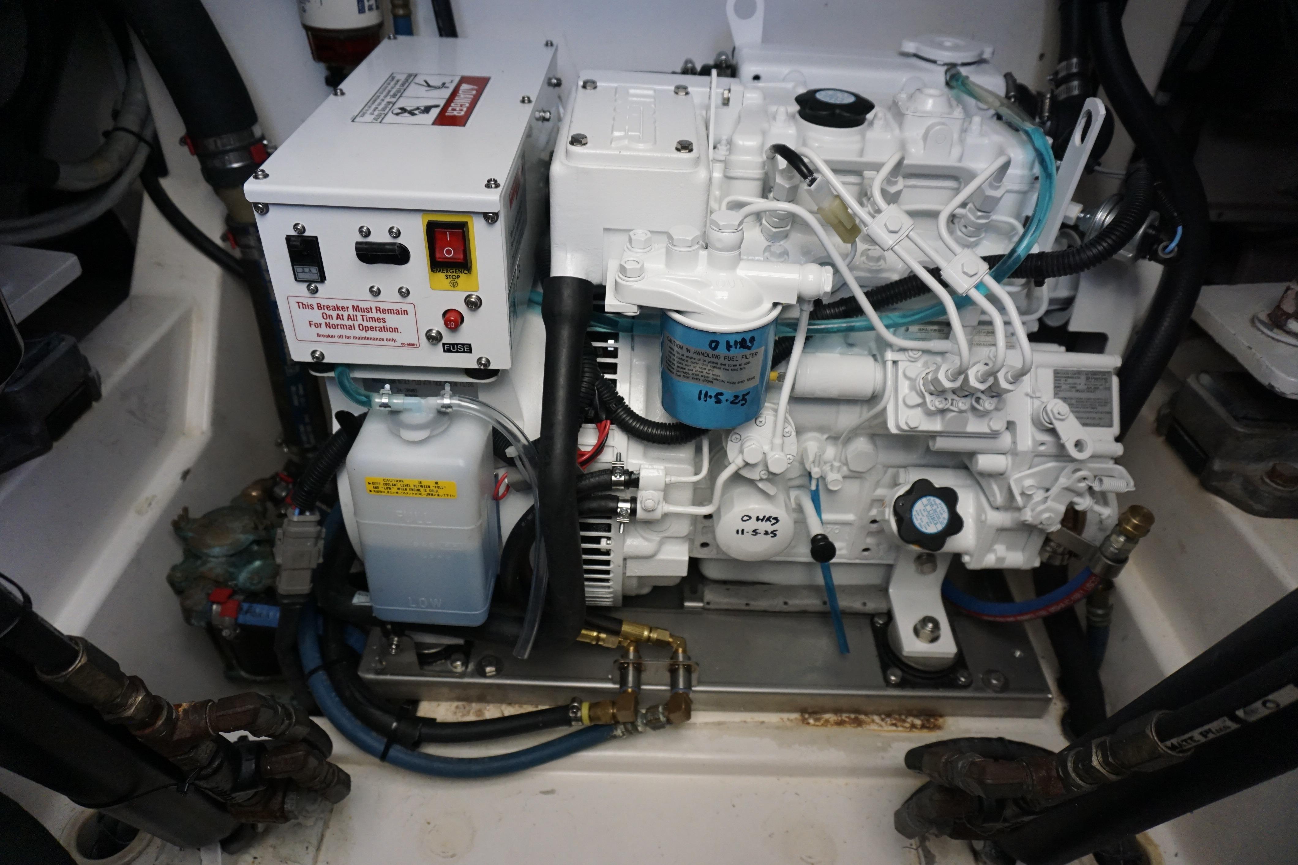 Engine compartment of a 2005 Cabo 35 Express boat, showcasing mechanical components and wiring.