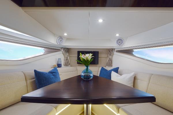 Manufacturer Provided Image: Interior of 2023 Sea Ray Sundancer 320 yacht with elegant seating and table.