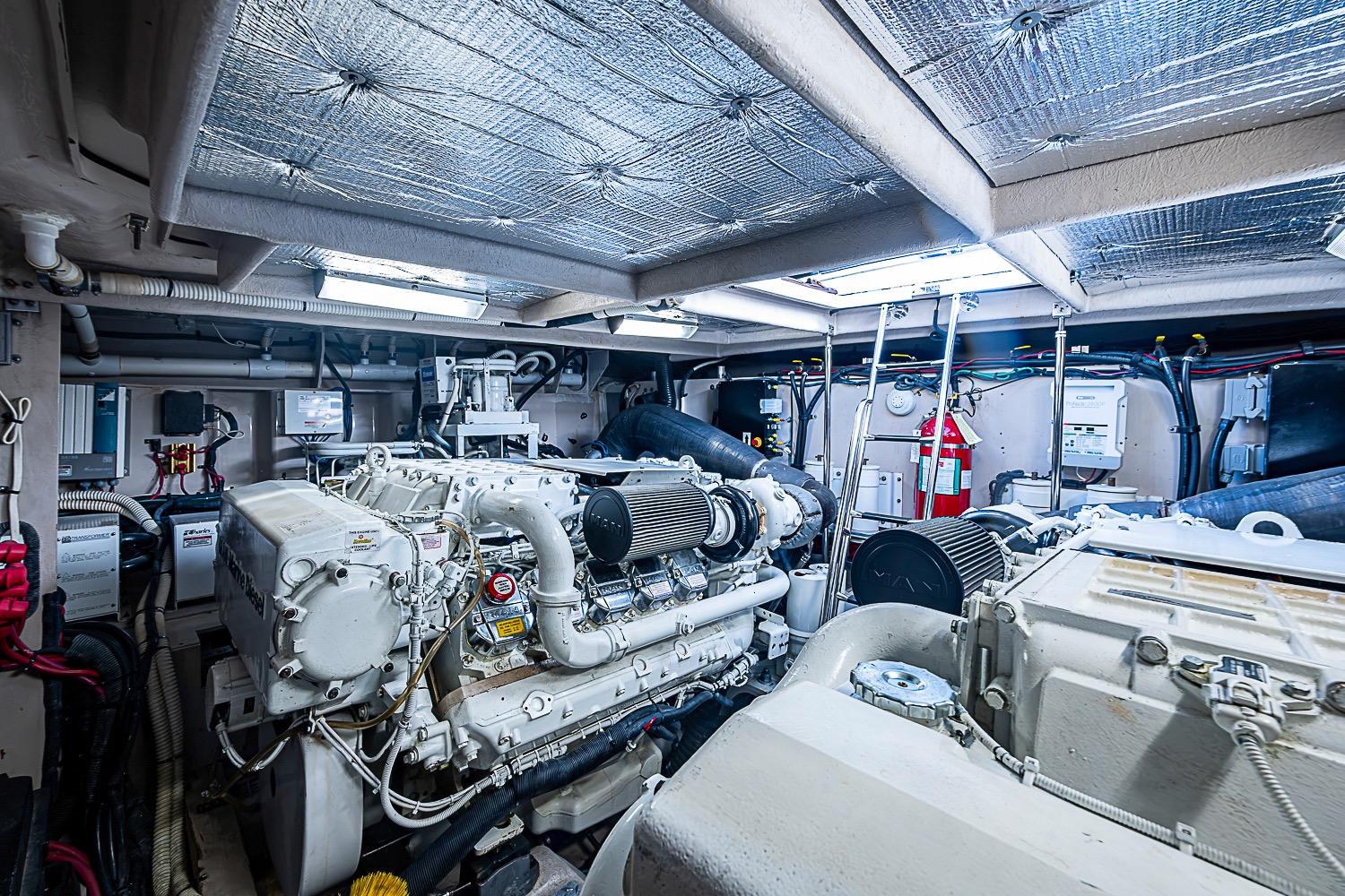 Engine room of a 2008 Sea Ray 60 Sundancer yacht, showcasing powerful machinery and equipment.