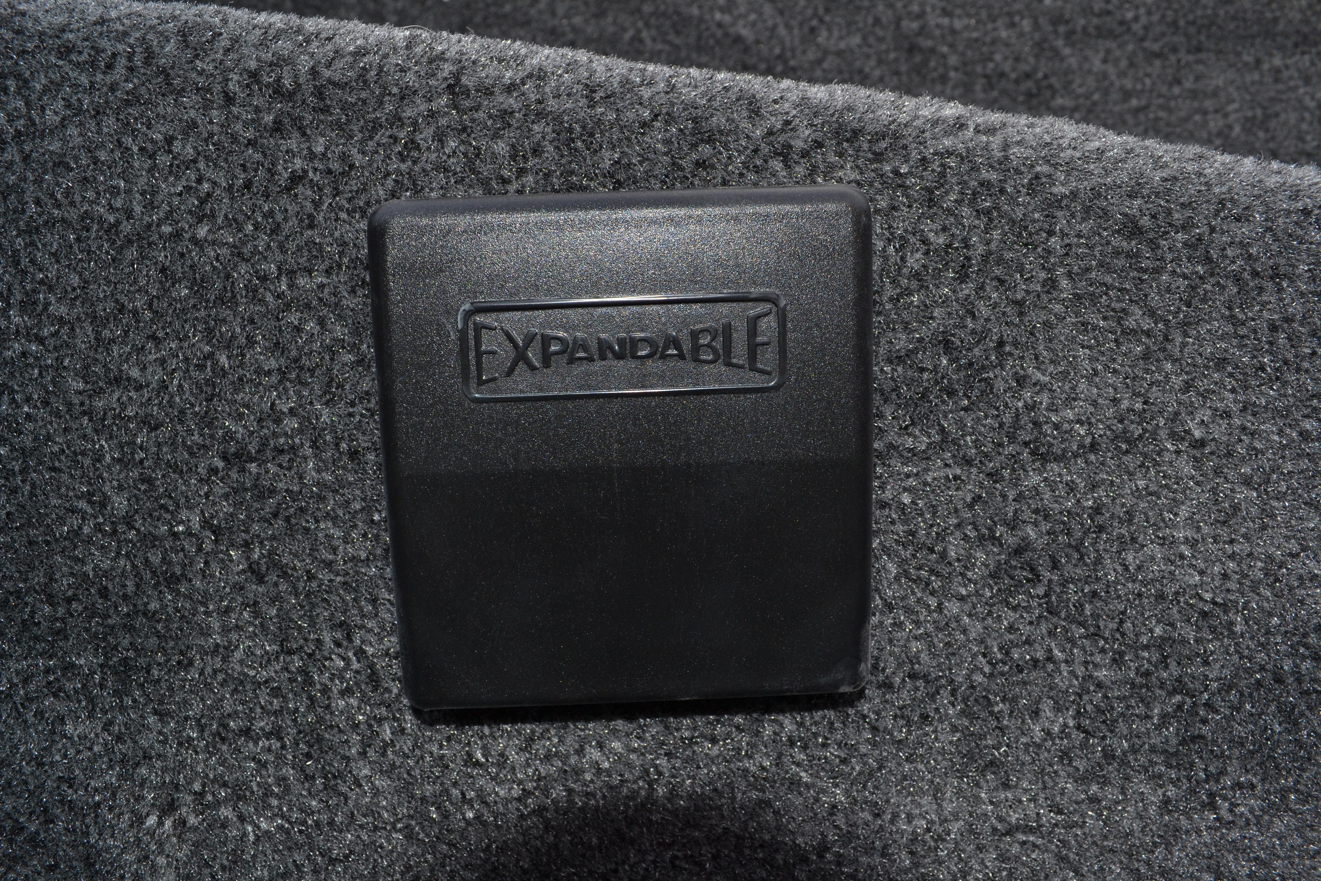 Expandable compartment in 2026 Ranger RT188 boat, featuring textured black cover.