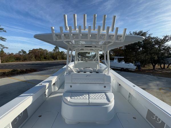 2025 Yellowfin 39 Offshore boat with spacious deck and rod holders, parked outdoors.