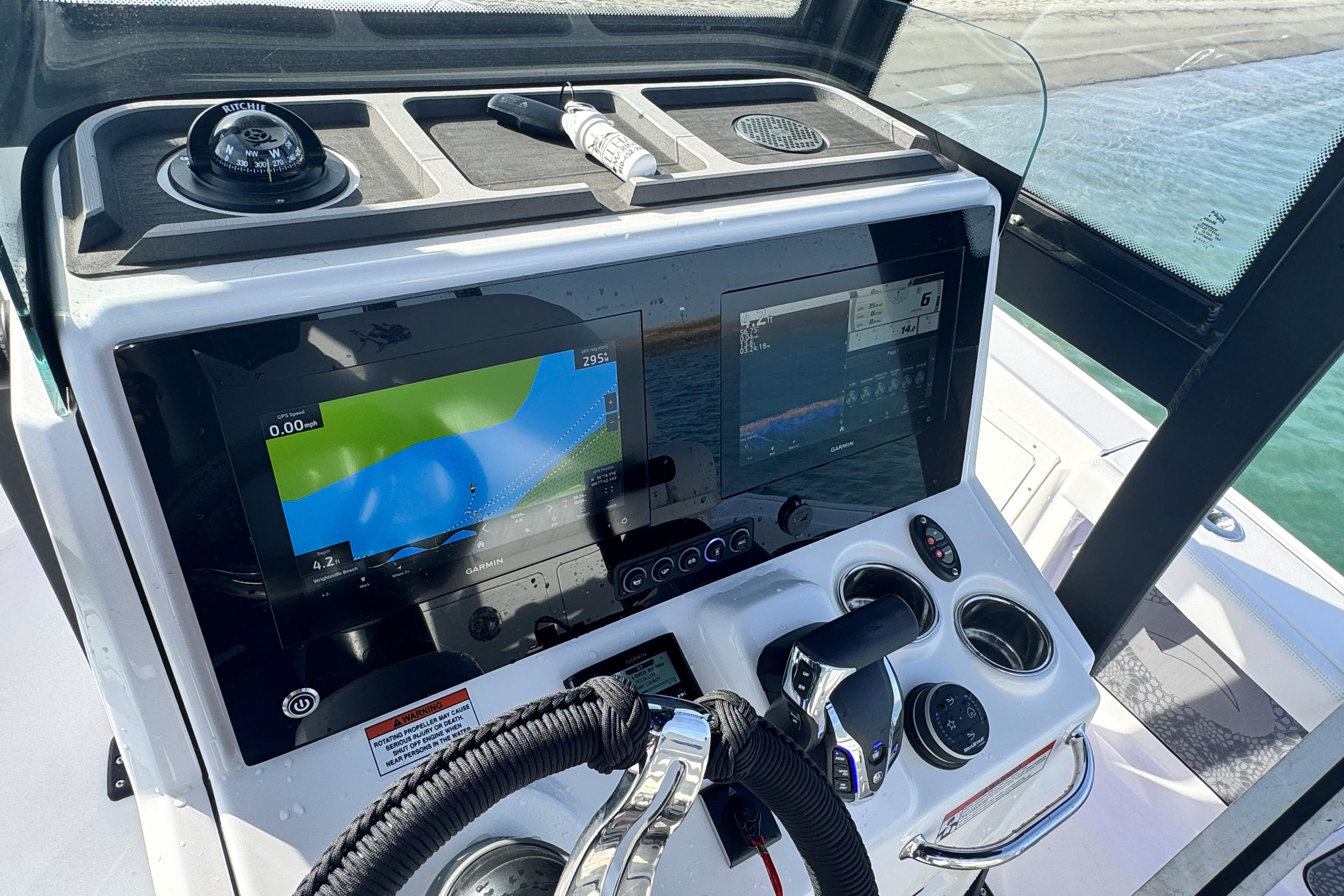 2025 Crevalle 24 HCO boat dashboard with navigation screens and controls.