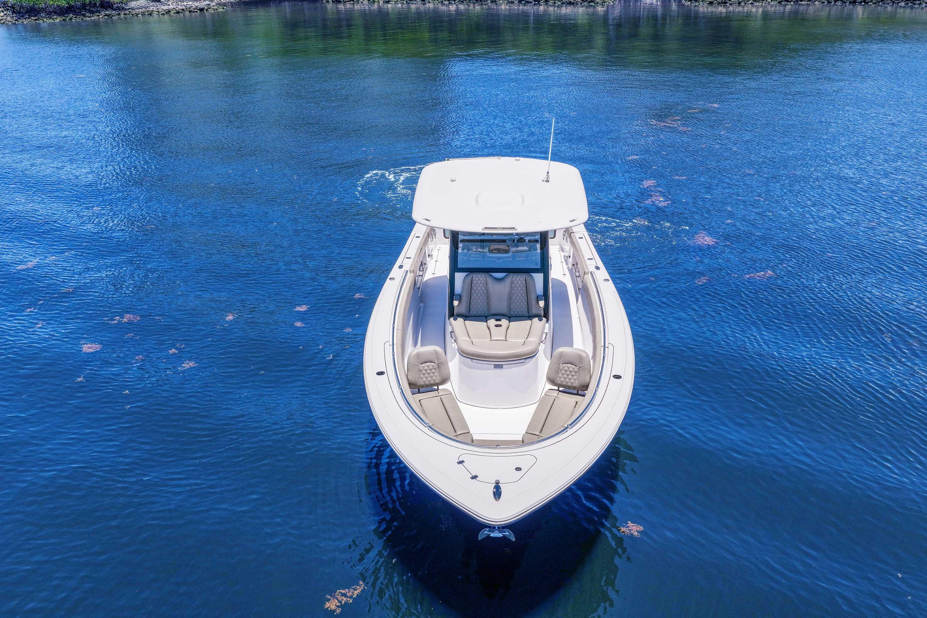 2024 Sportsman Open 352 Center Console boat on calm blue water.