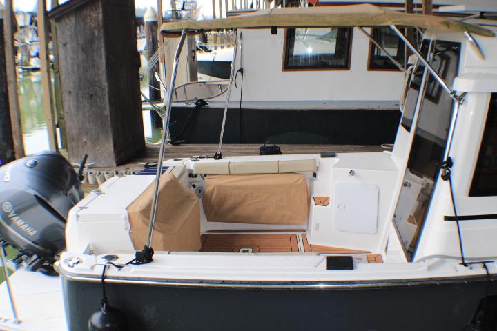 2020 Ranger Tugs R-27 boat with Yamaha outboard motor, docked at marina.