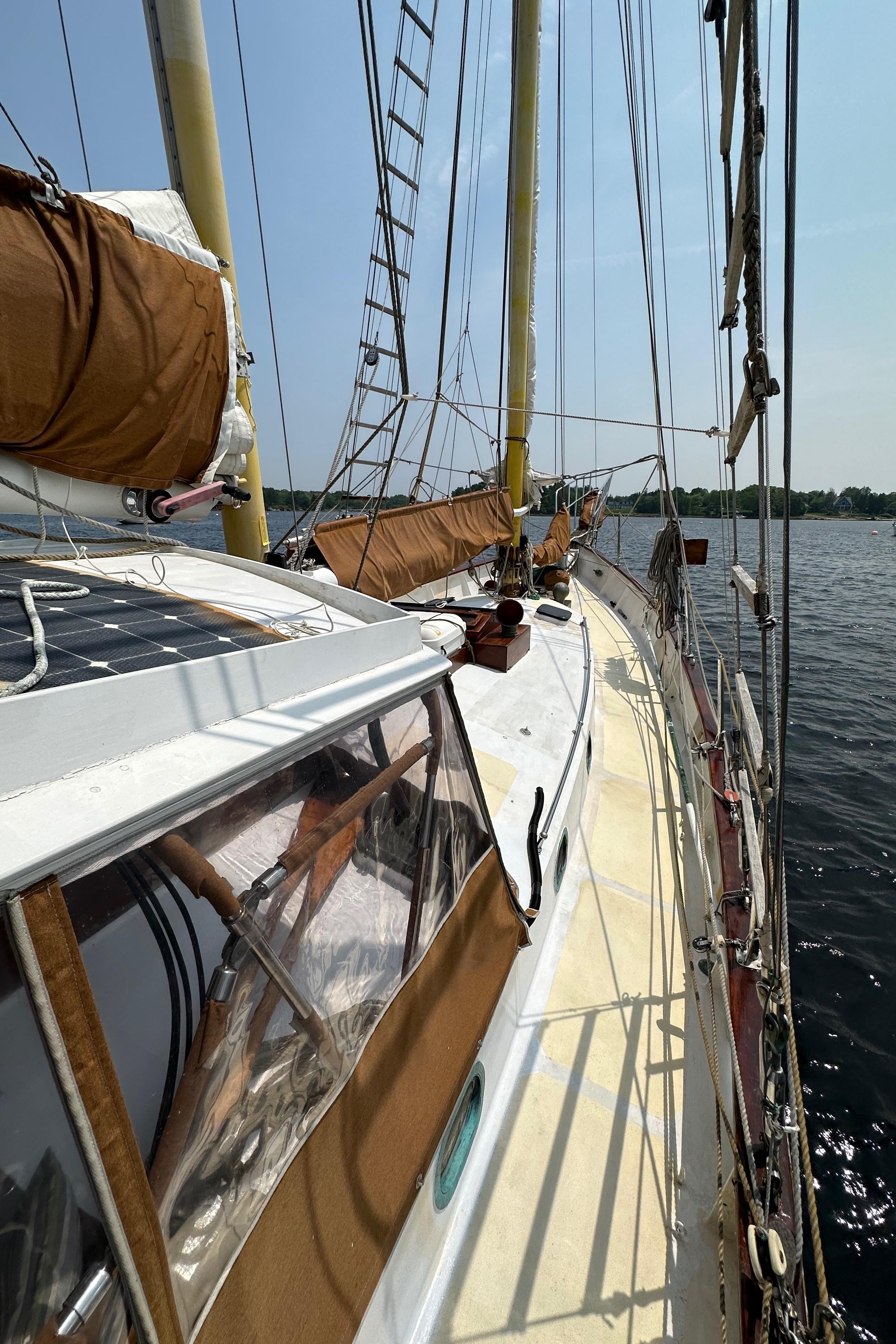 1985 Custom Thomas Colvin "Pipistrelle" sailboat on water, showcasing deck and rigging.