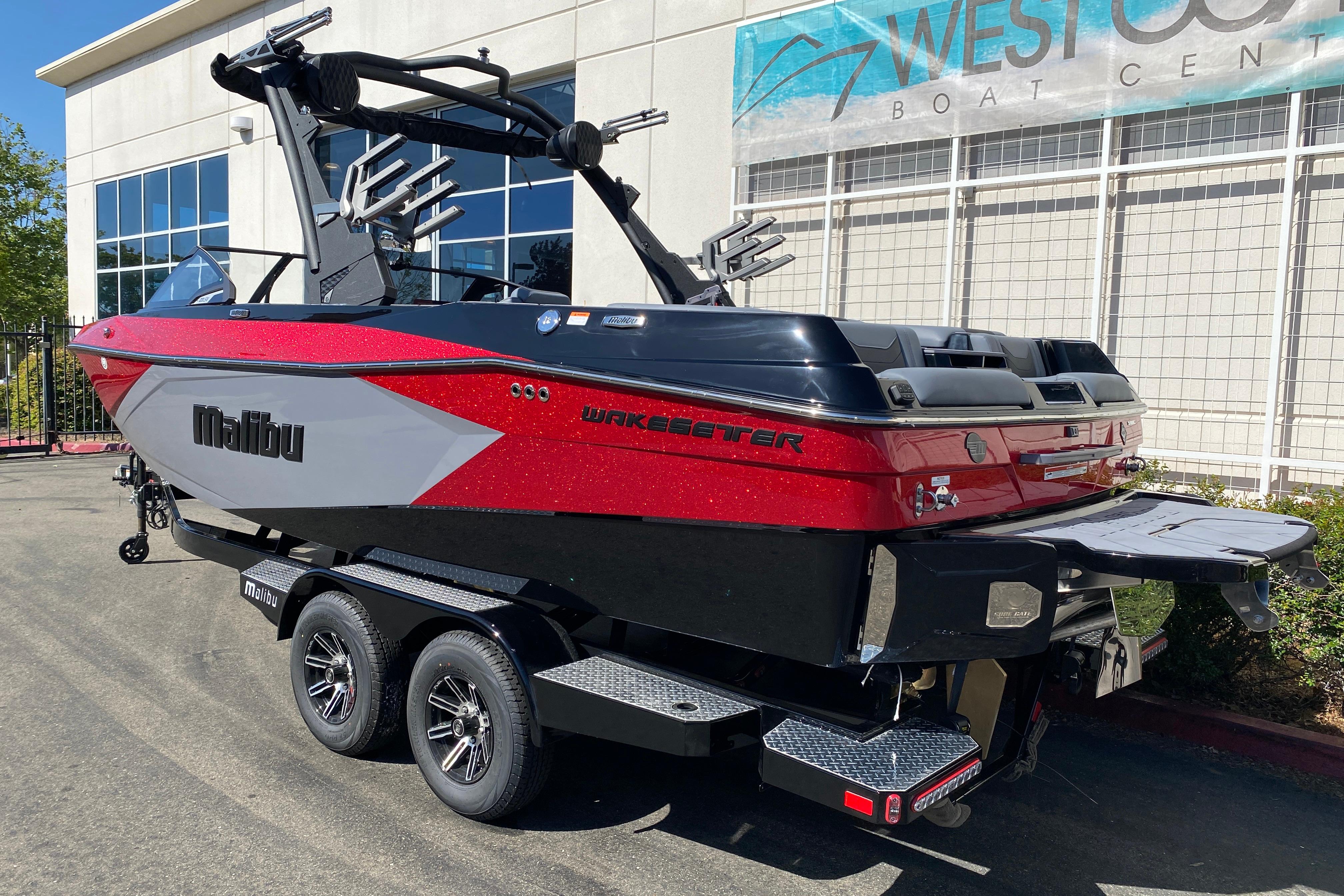 2025 Malibu Wakesetter 23 LSV boat in red and black at West Coast Boat Center.