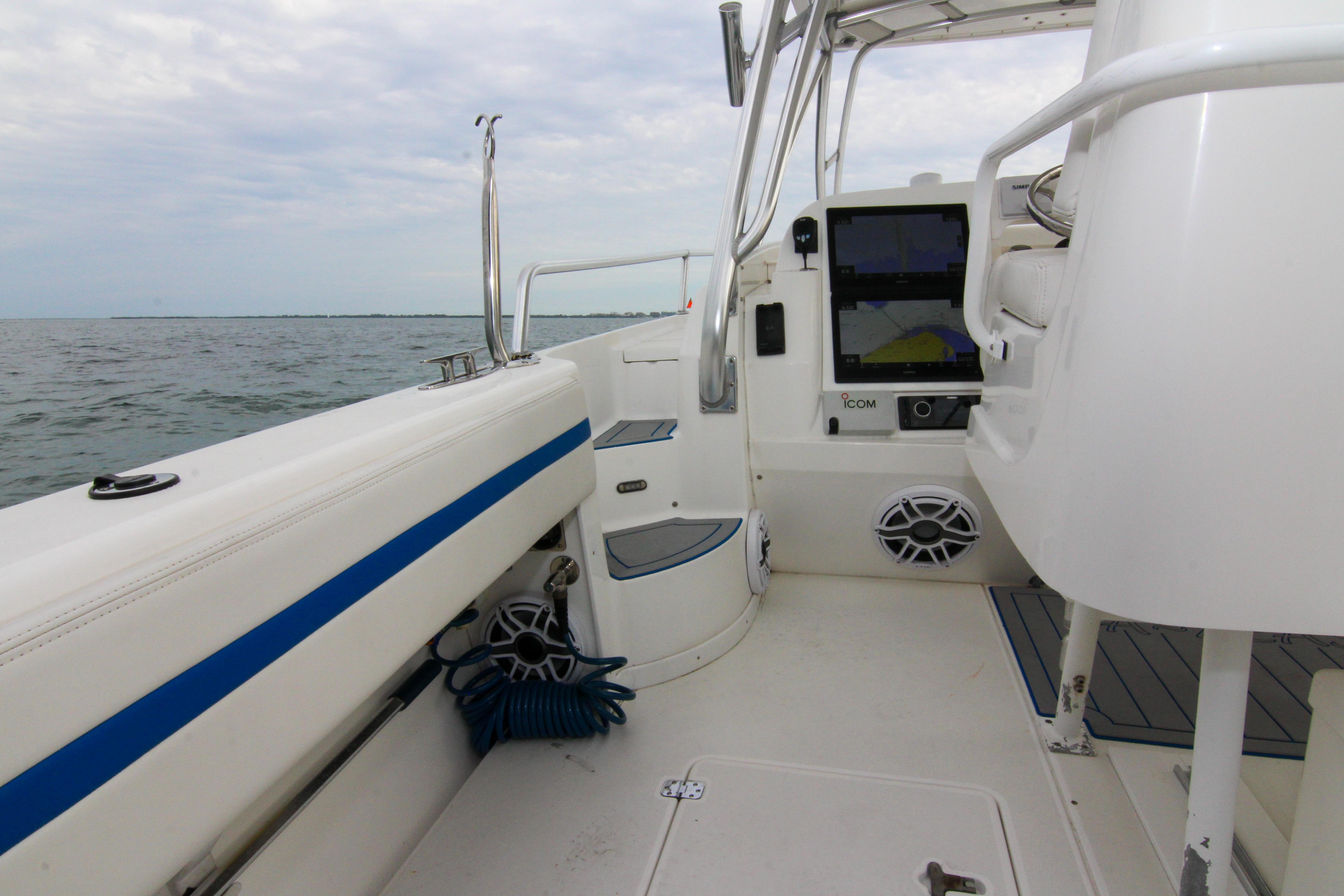 2003 Intrepid 377 Walkaround boat interior with navigation equipment and ocean view.
