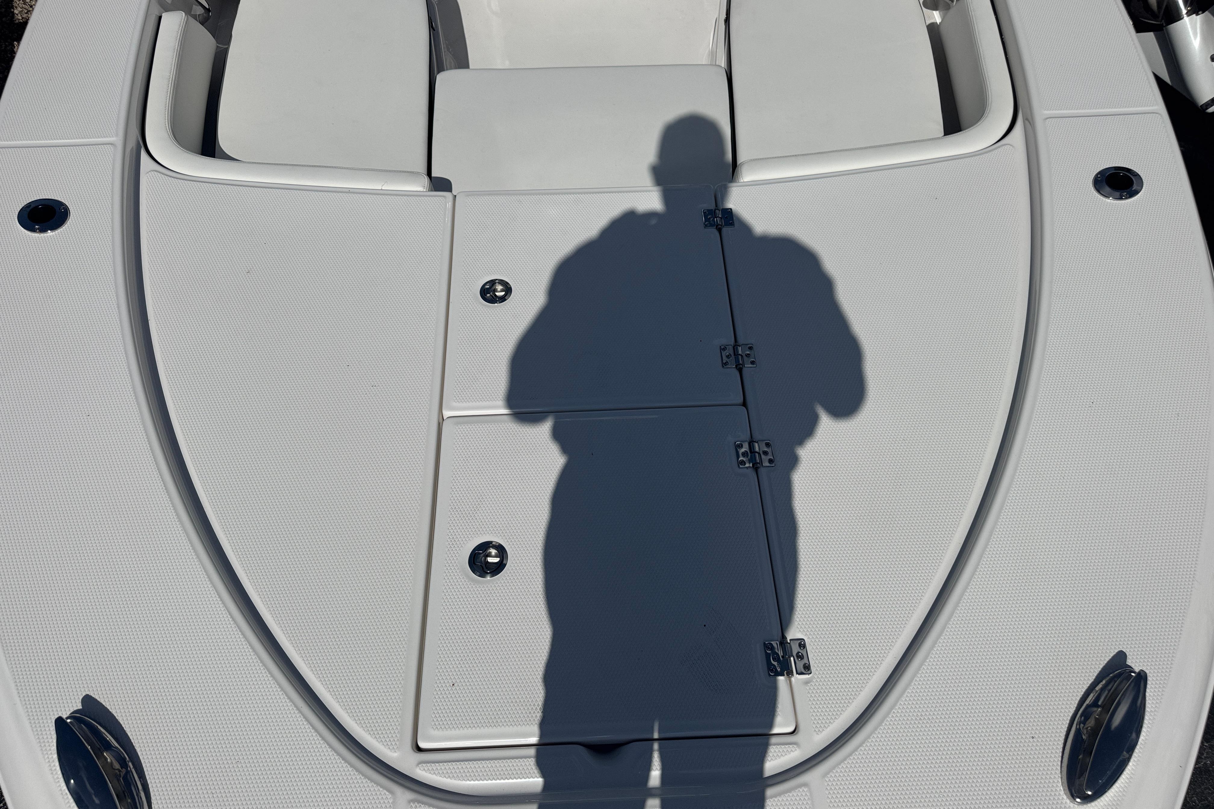 Shadow on the deck of a 2025 Robalo 246 Cayman SD boat.