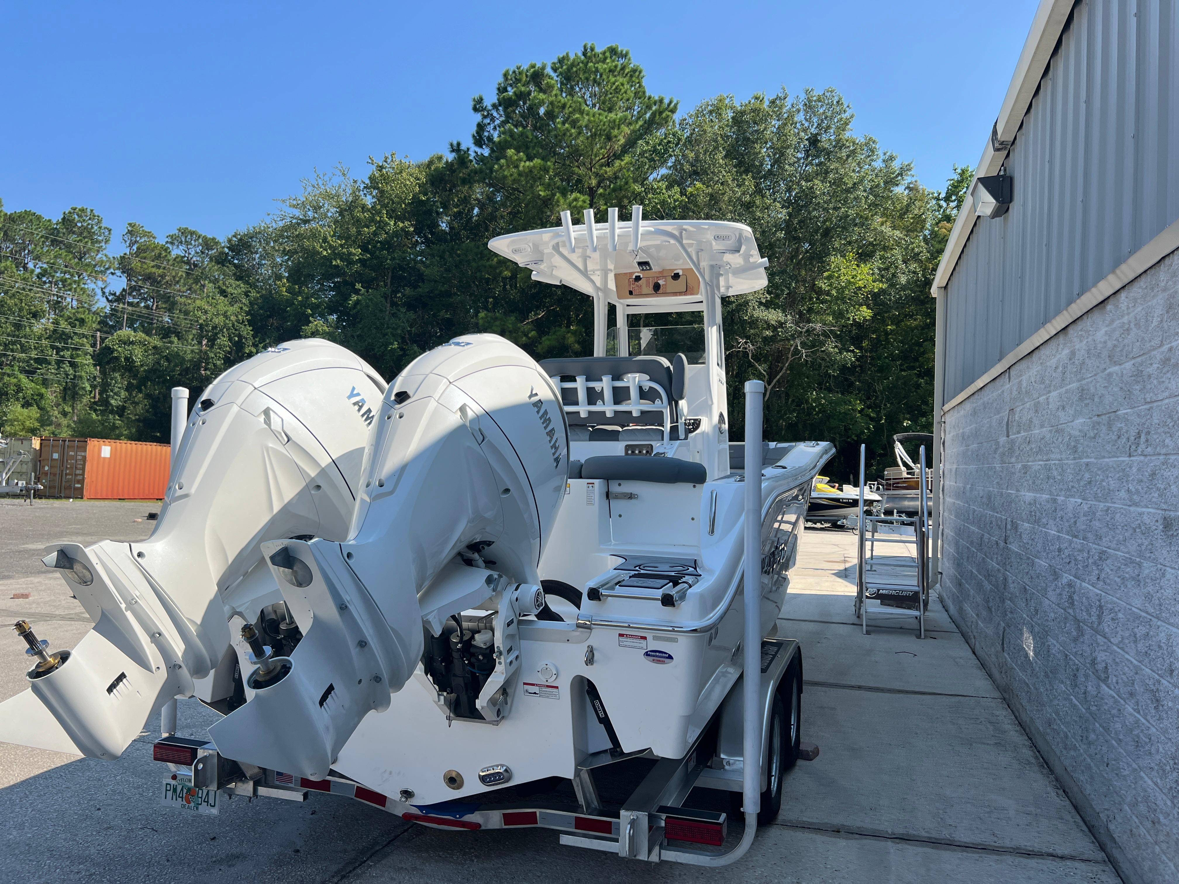 2025 NauticStar 252L boat with dual Yamaha engines on a trailer.