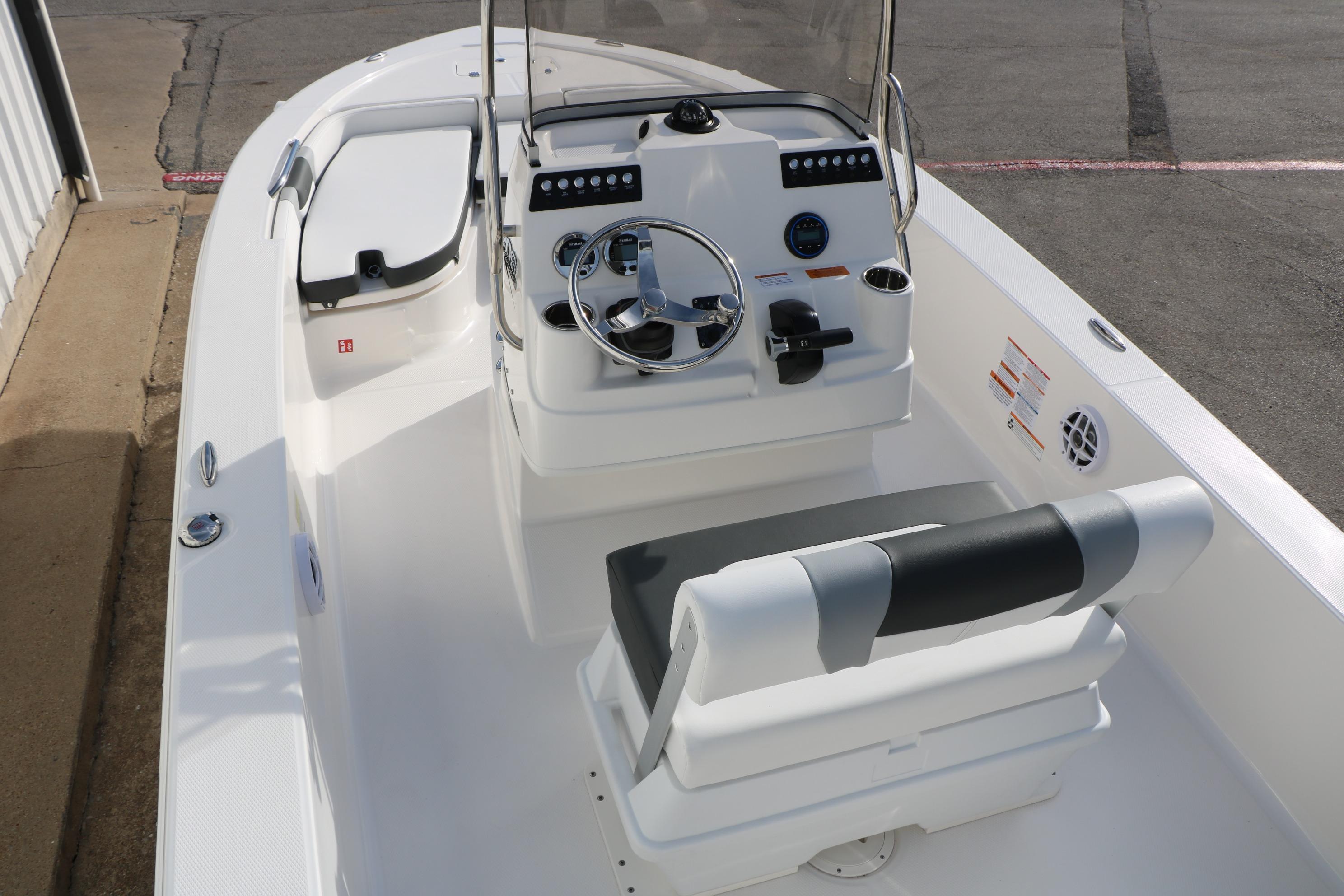 2026 Robalo 206 Cayman boat interior with steering console and seating.