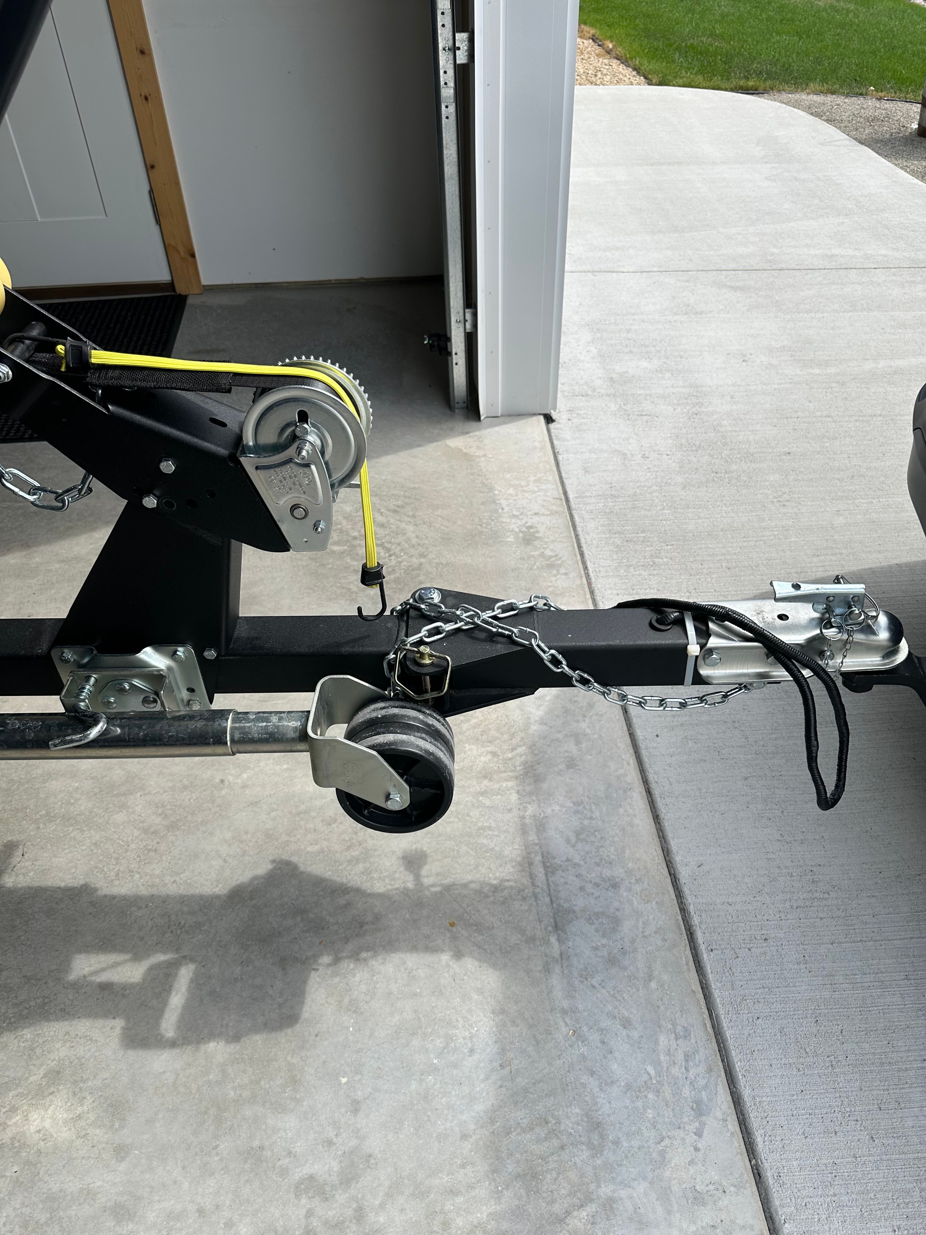 Trailer of a 2025 Lund Pro Angler 1650 in a garage.