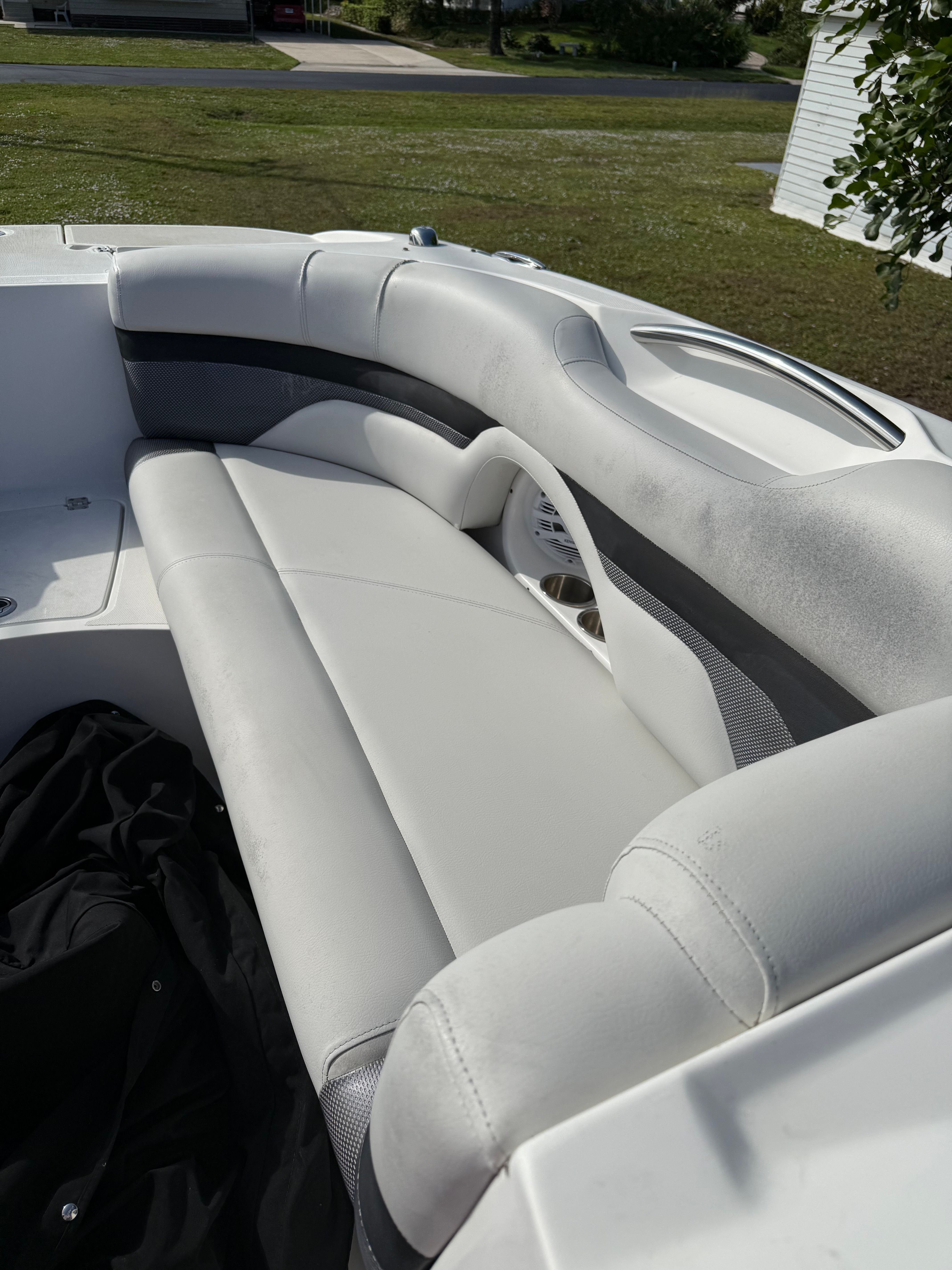 Interior of a 2018 Hurricane SunDeck 2690 OB boat with white seating.