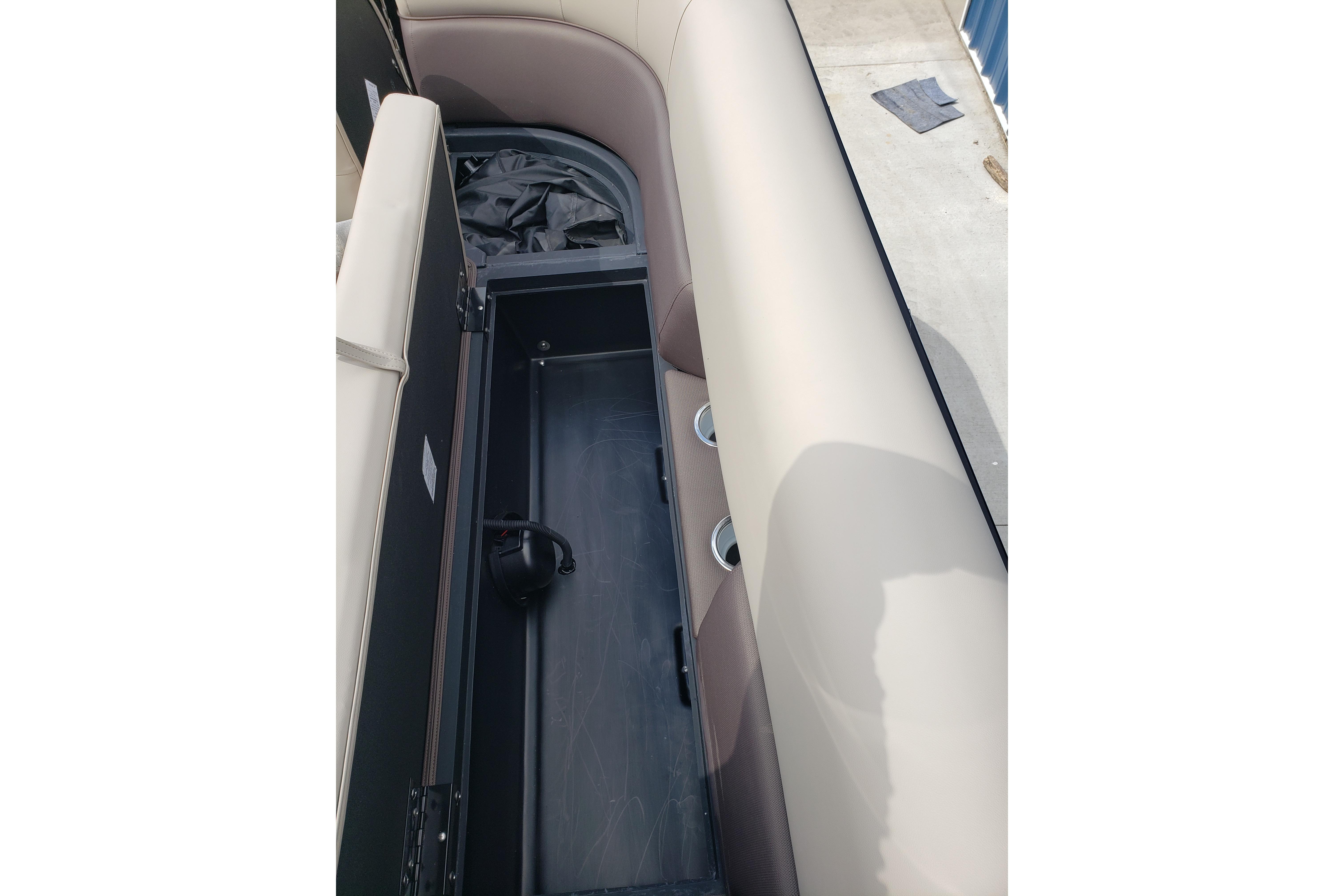 Open storage compartment in 2026 Bentley Pontoons Elite 253 QSB boat.