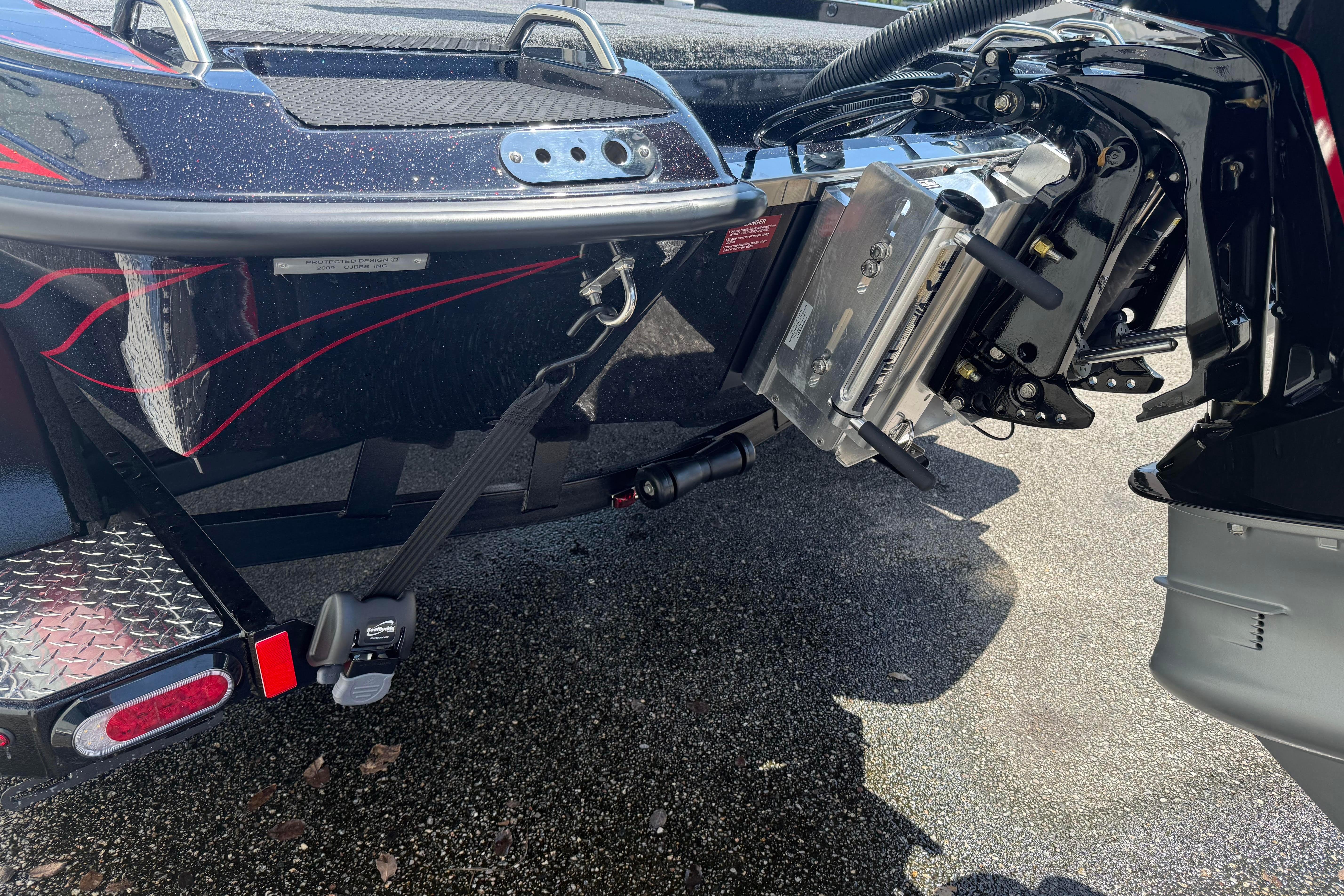 Rear view of a 2027 Phoenix 919 ZXL boat with motor and trailer details.