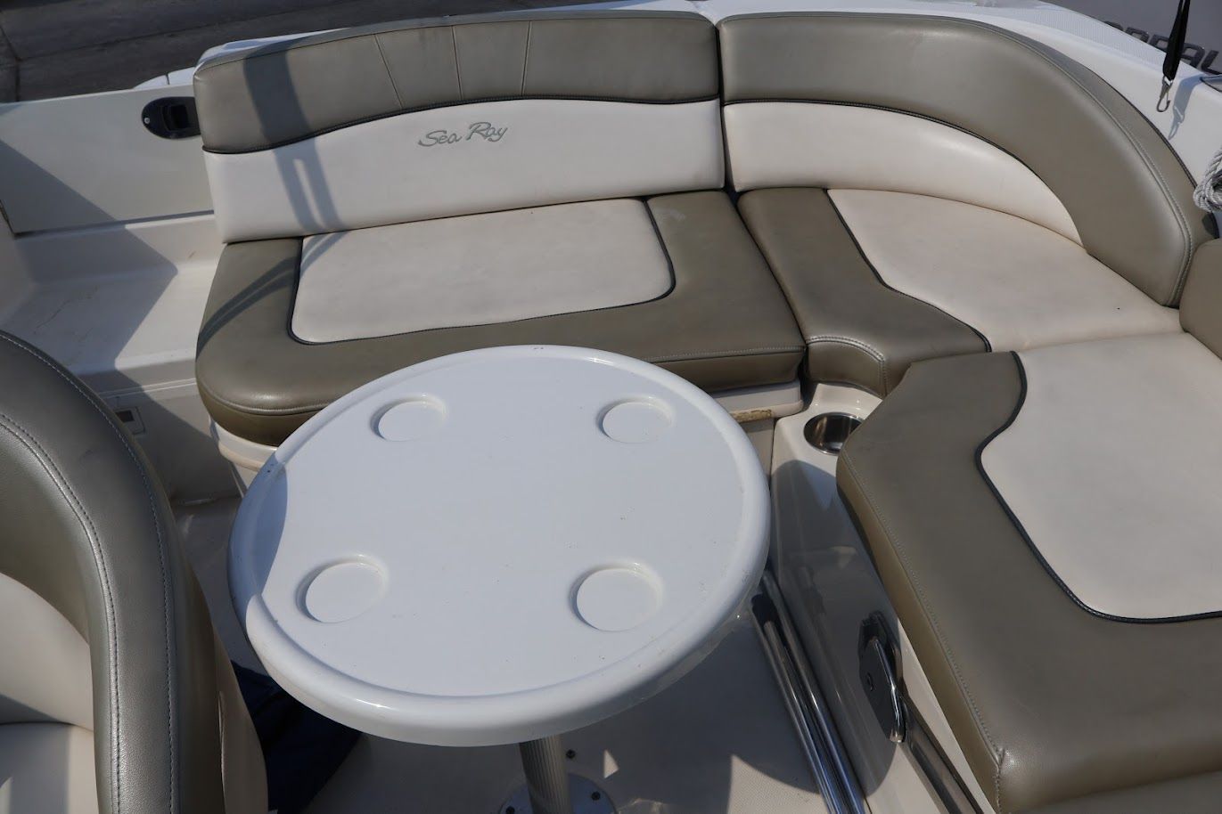 Interior of a 2006 Sea Ray Sun Deck 200 with seating area.