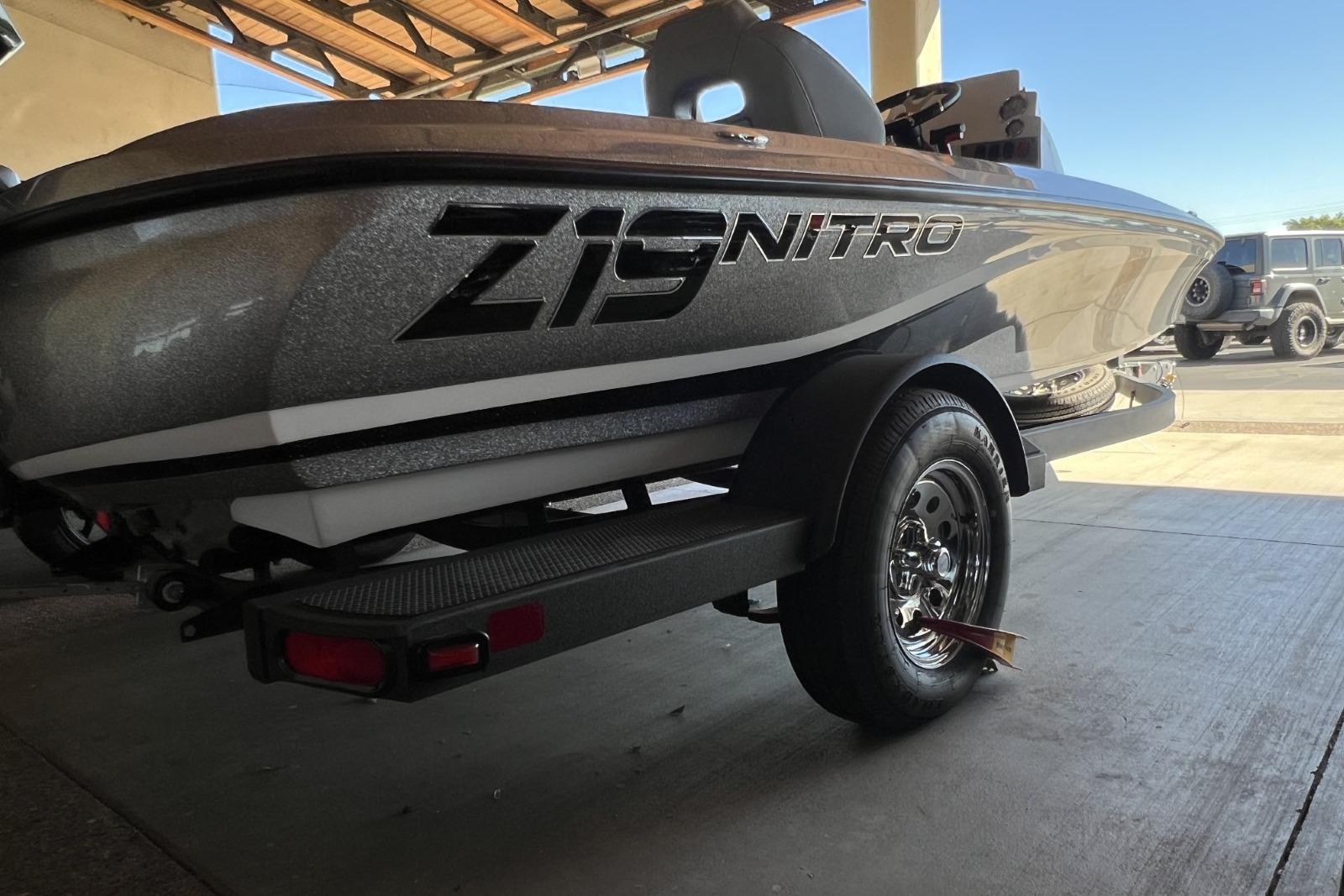 2025 Nitro Z19 boat on trailer, parked in a covered area.