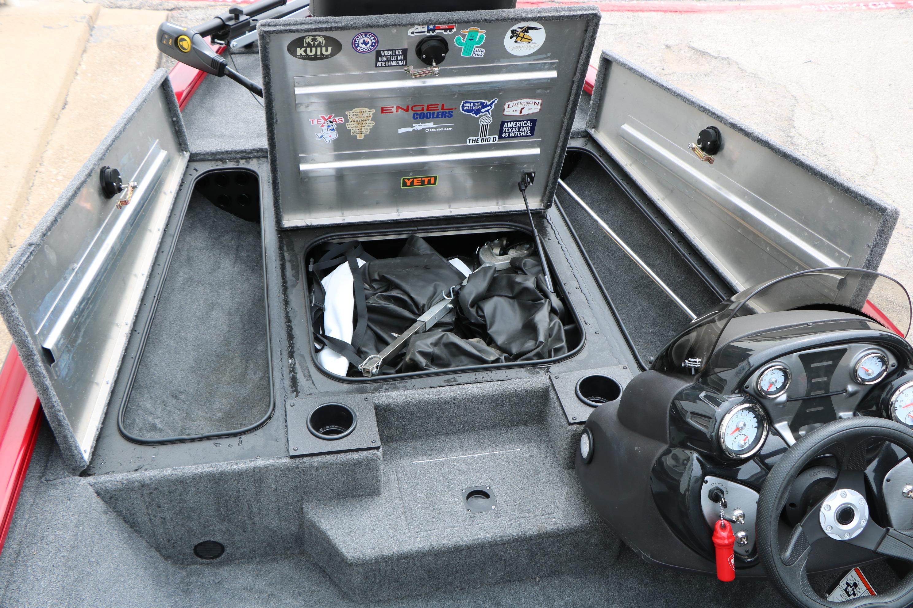 2024 Tracker Pro Team 175 boat interior with storage compartments and control panel.