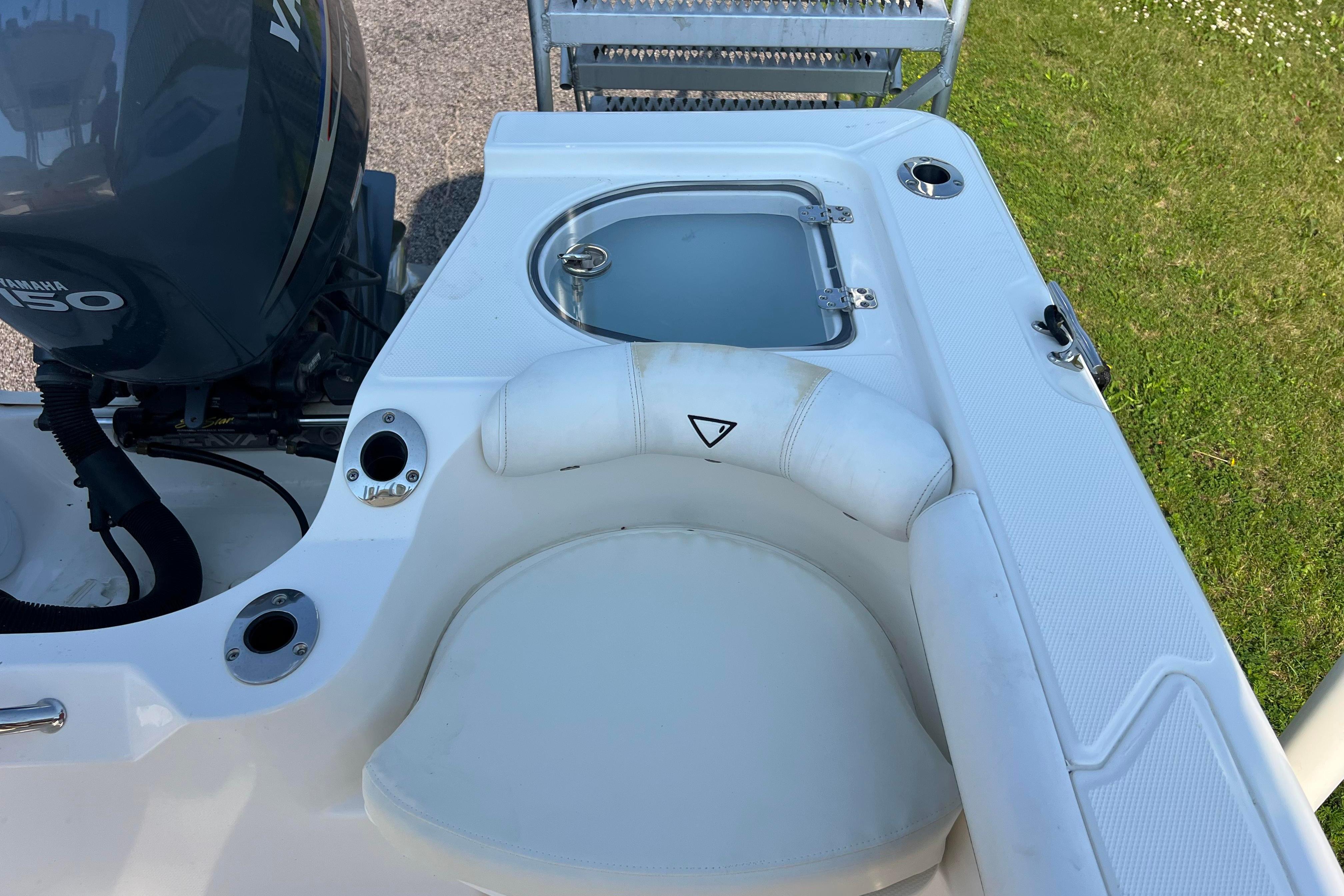 2012 Sea Fox 206 Center Console boat with Yamaha engine and seating area.