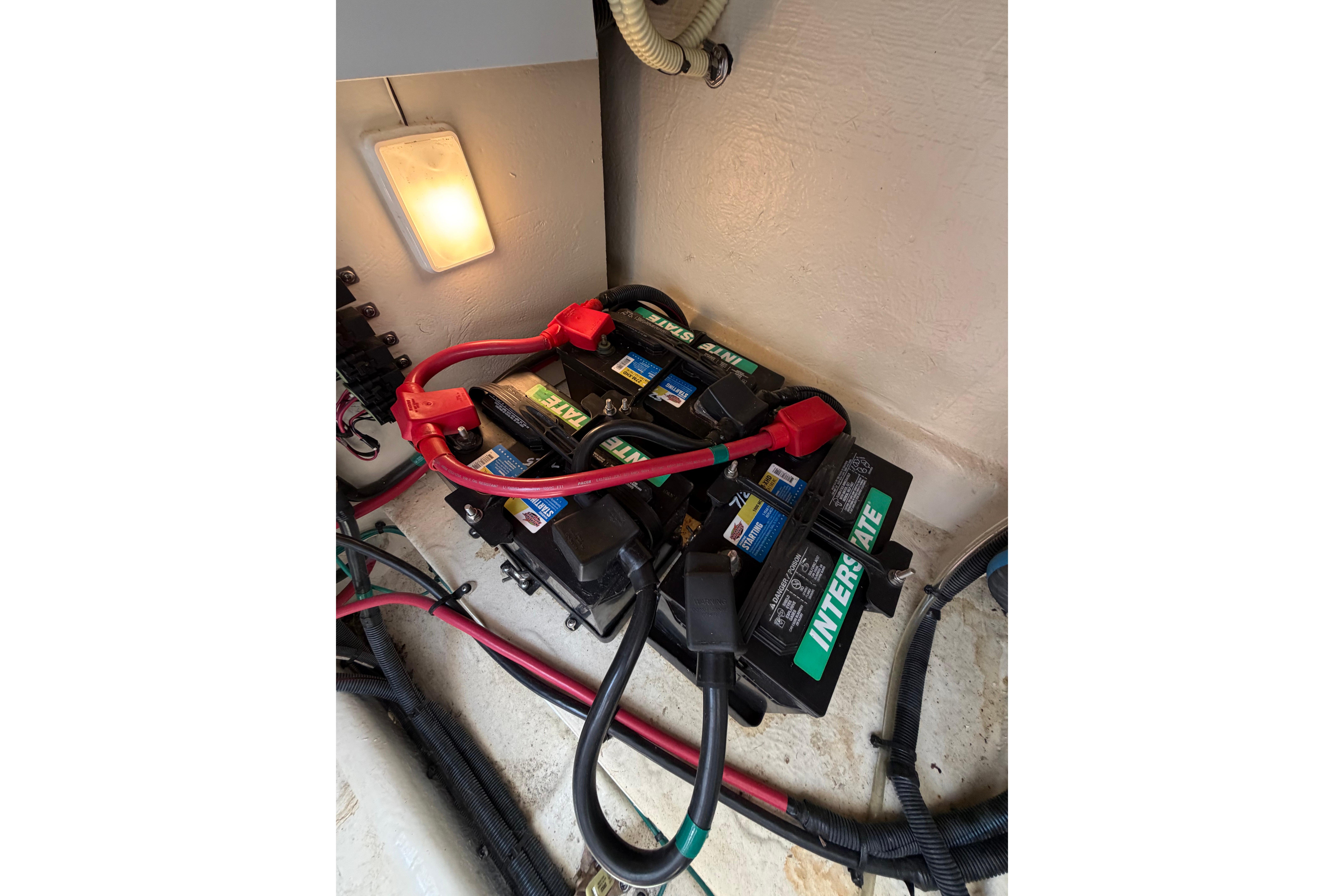 Battery setup in a 2012 Sea Ray Sundancer 370 boat, featuring Interstate batteries.