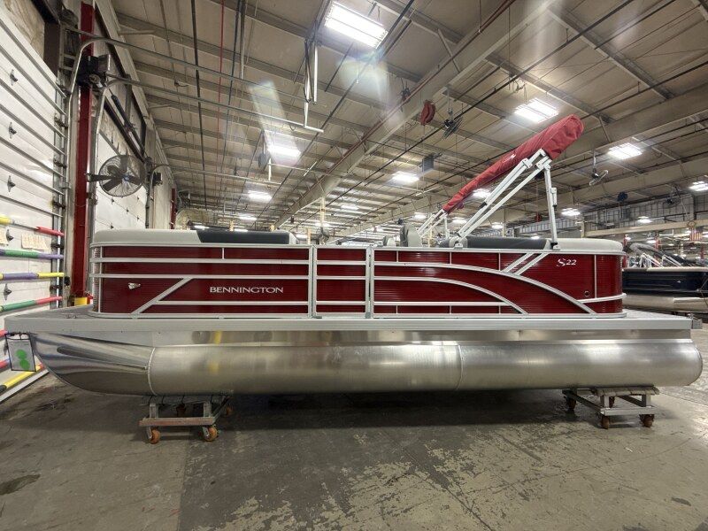 2026 Bennington S Series 22 SSR pontoon boat in a workshop.