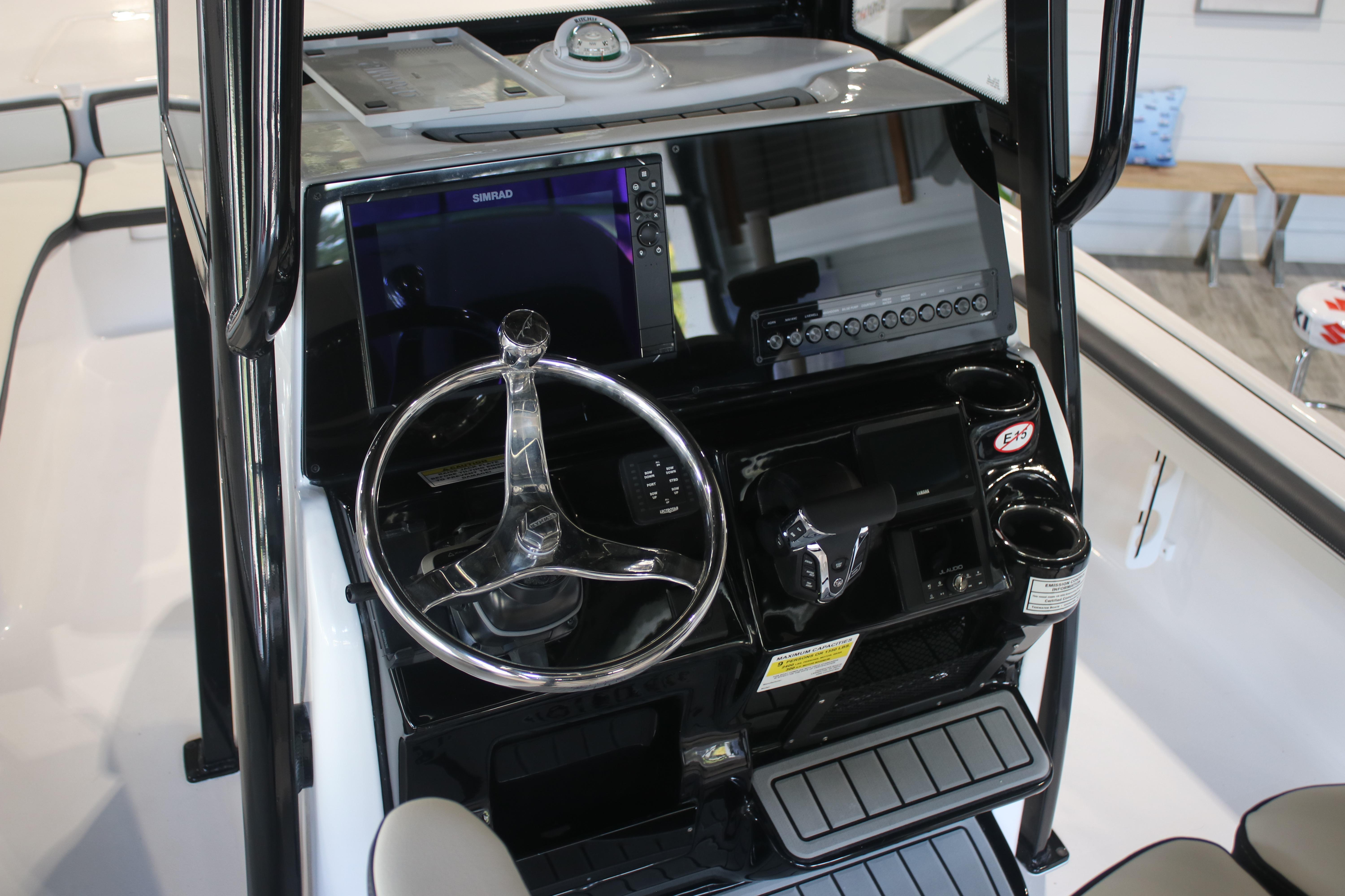 2026 Tidewater 2300 Carolina Bay boat console with steering wheel and navigation system.