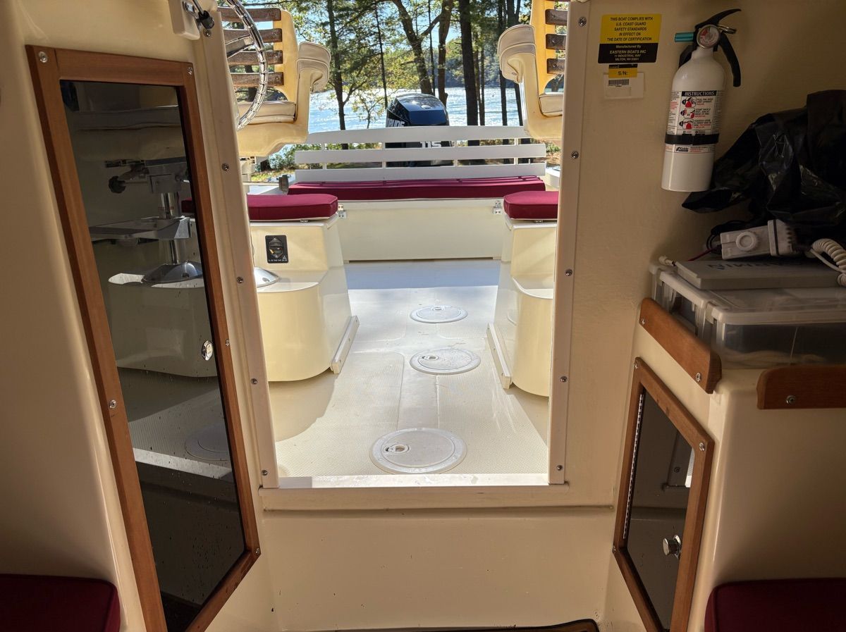 Interior view of a Seaway Seafarer 21 boat, showing the deck and lake beyond.