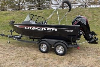 2026 Tracker Pro Guide V-175 WT boat on trailer, parked on grass.