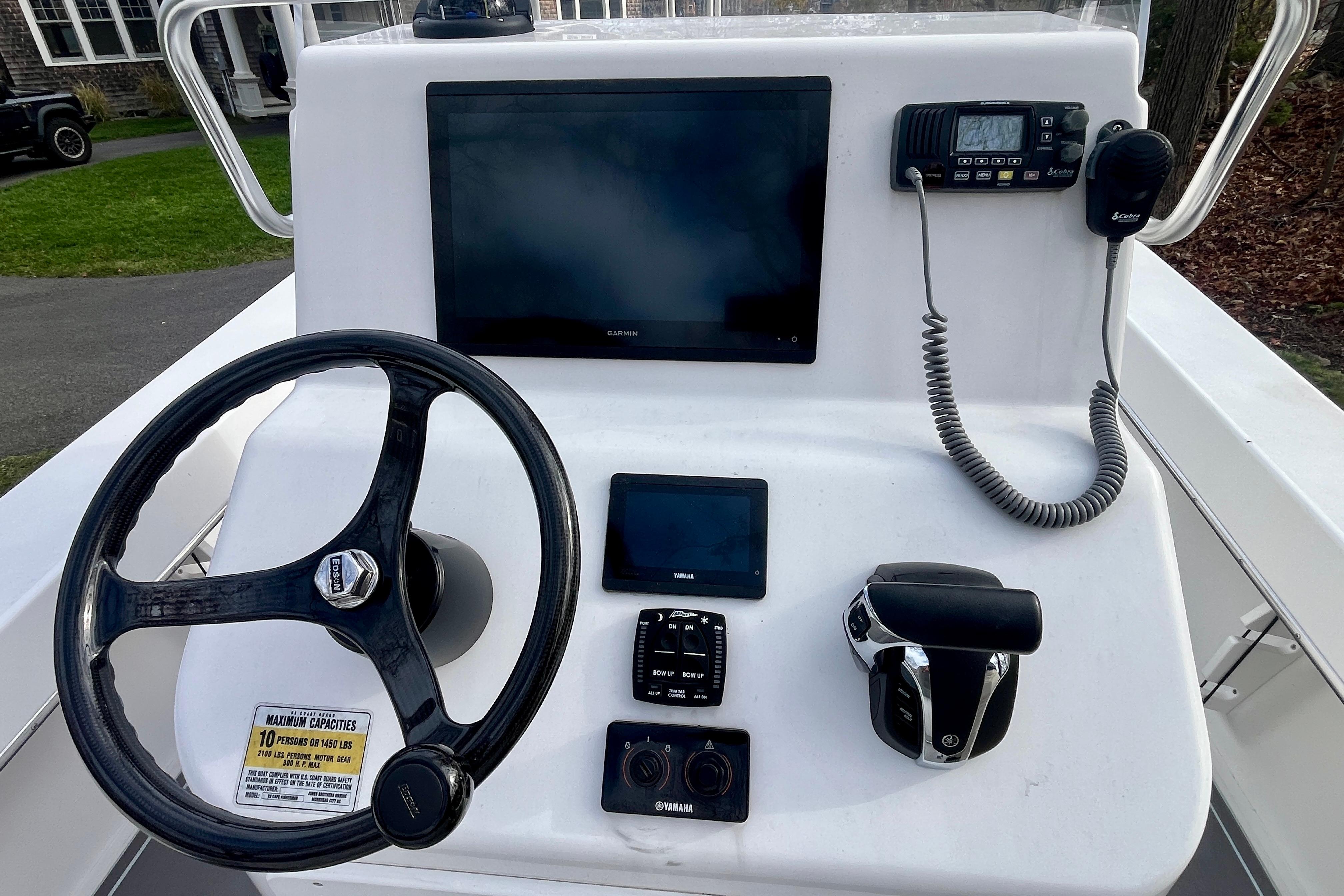 2023 Jones Brothers 23 Cape Fisherman Lite Tackle boat console with steering wheel and controls.
