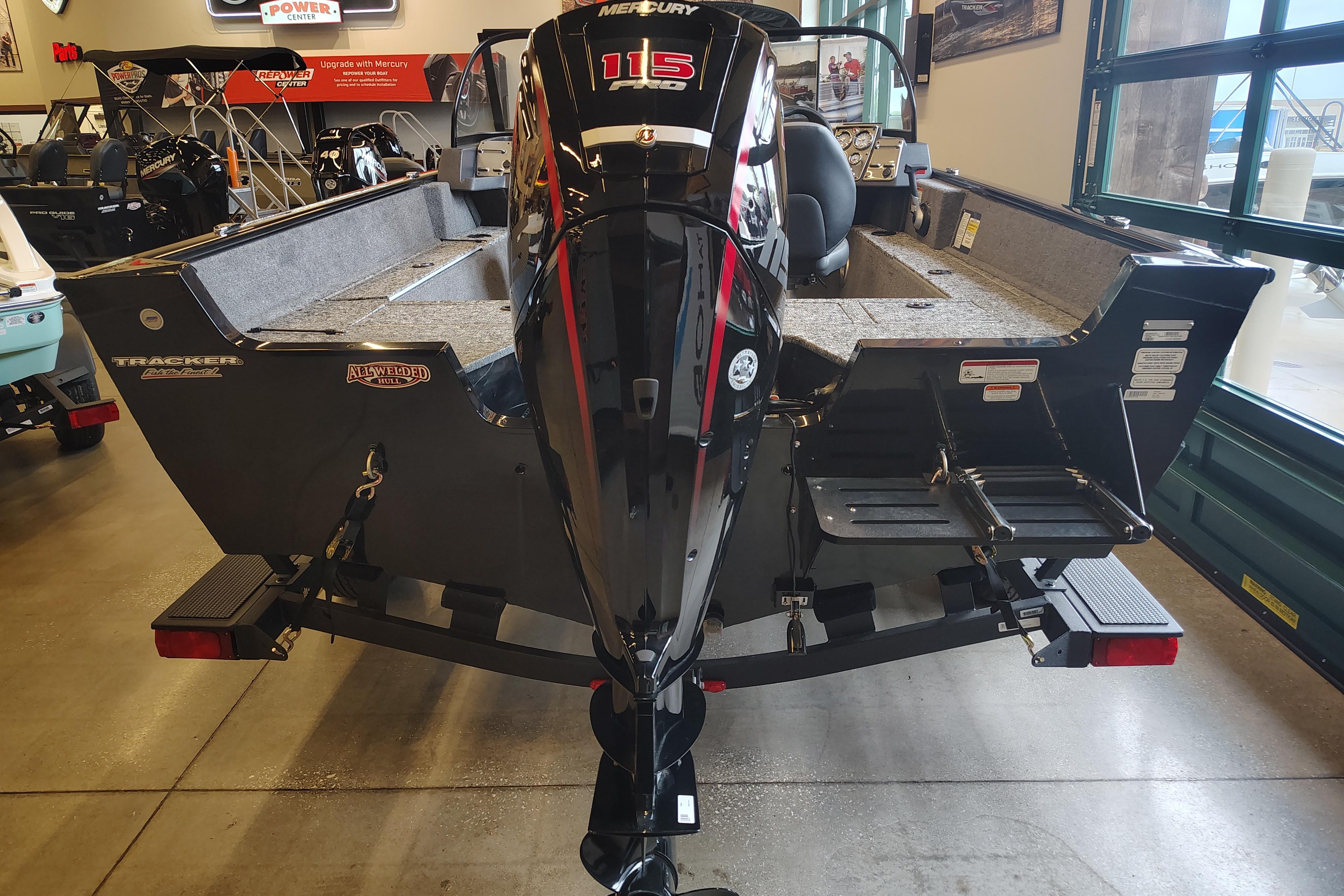 2026 Tracker Pro Guide V-175 WT boat with Mercury 115 engine in showroom.