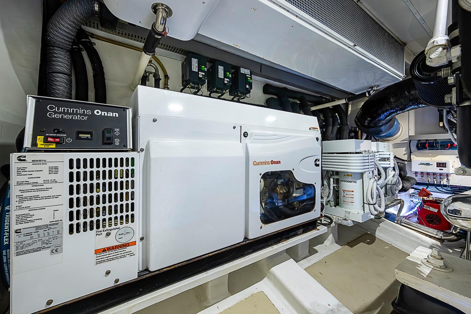 Engine room of 2014 Marlow 80 Explorer with Cummins Onan generator and Dometic equipment.