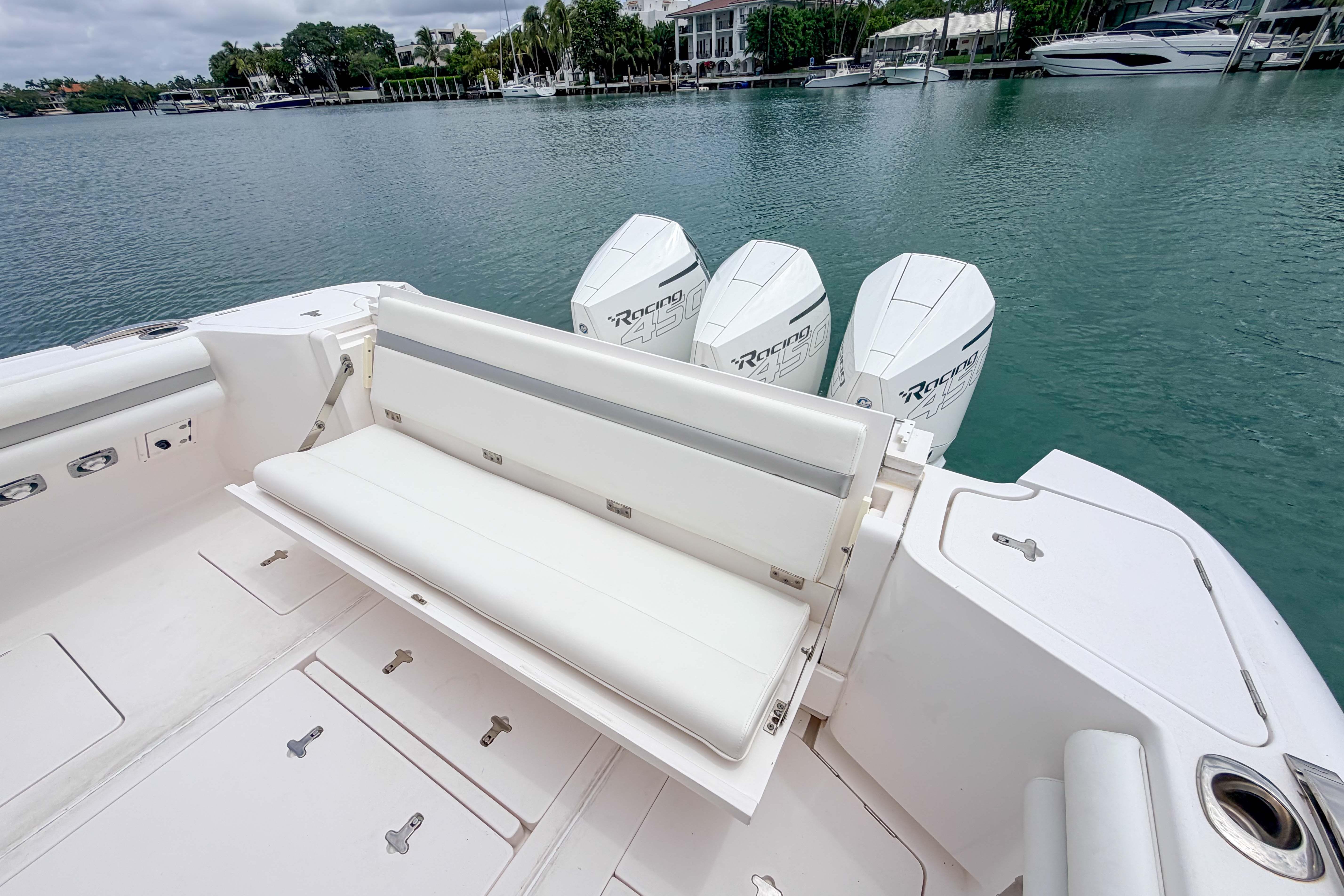 2021 Intrepid 409 Valor boat with white seating and powerful outboard engines.