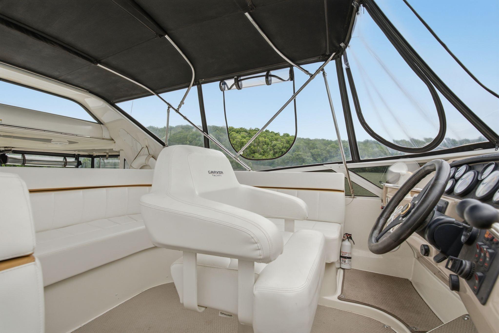Interior of 2005 Carver 39 Motor Yacht with helm and seating area.