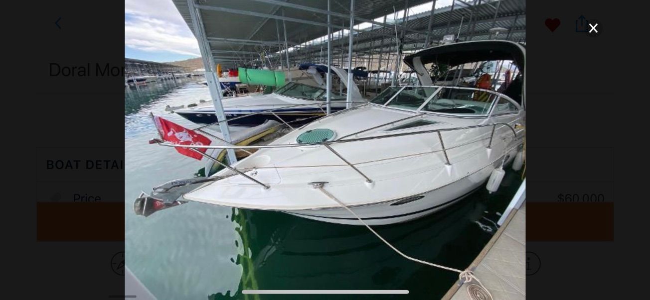 A 2007 Doral Monticello is docked in a covered marina.